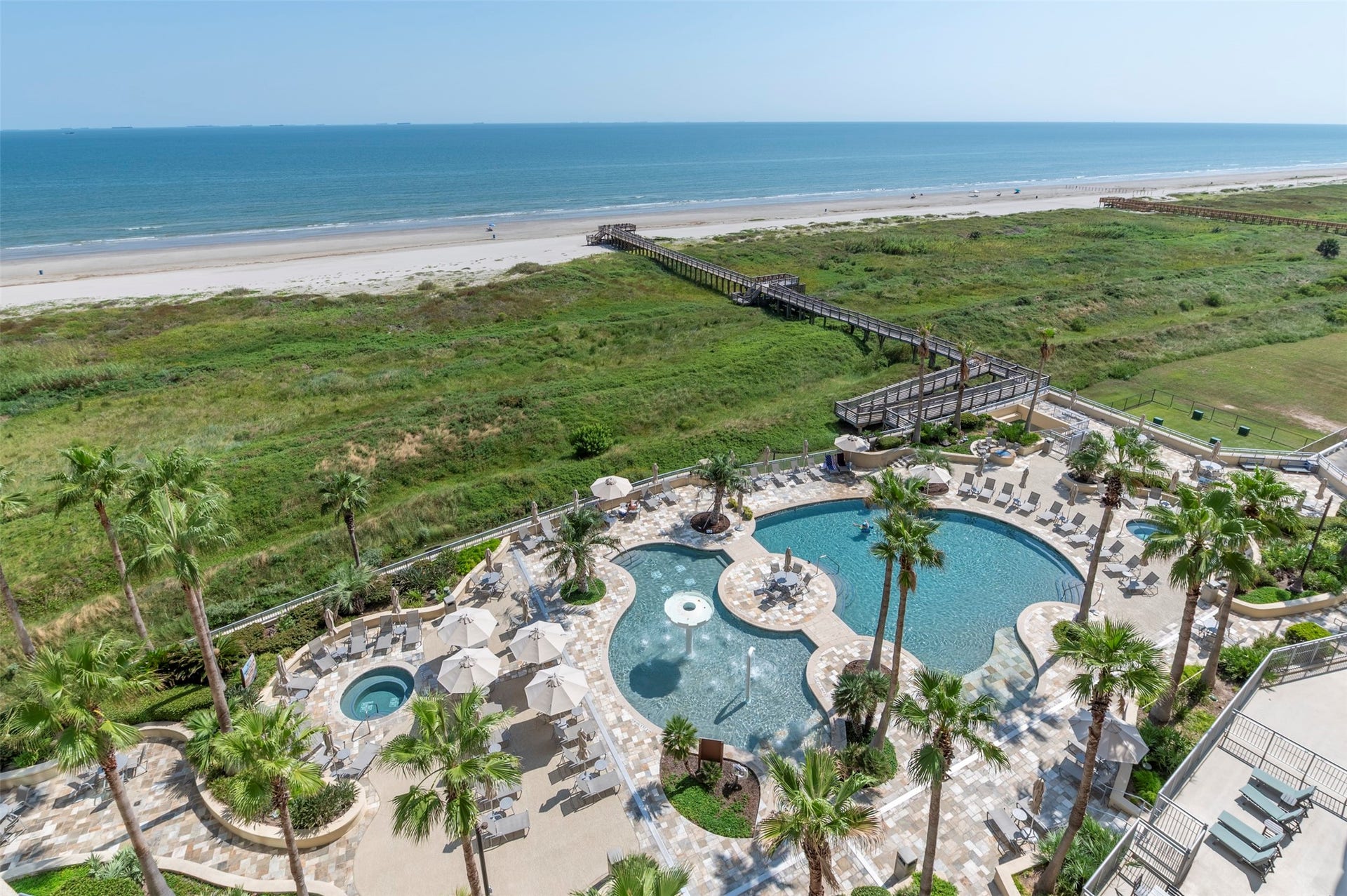 801 E Beach Drive, #BC2808, Galveston, TX 77550 Beachfront views overlook the Gulf, beach, pool deck and Palisade Palms direct beach access