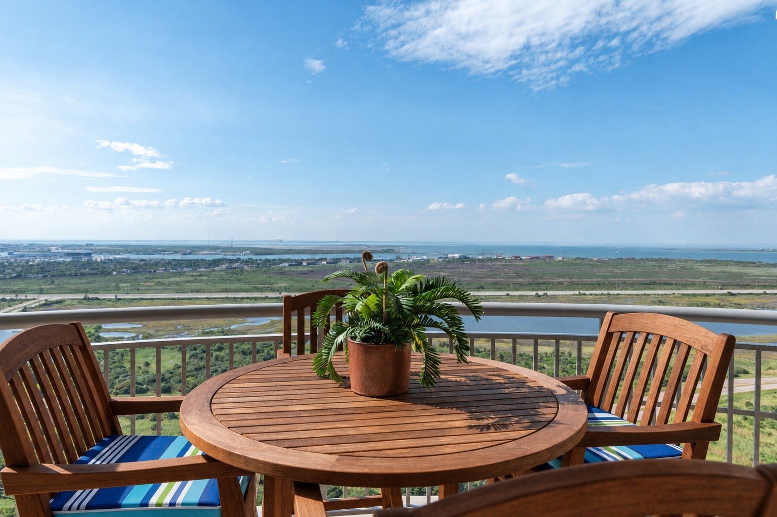 801 E Beach Drive, #BC2808, Galveston, TX 77550 Private balcony off the bay-view primary suite offers a comfortable outdoor seating area high above the island.