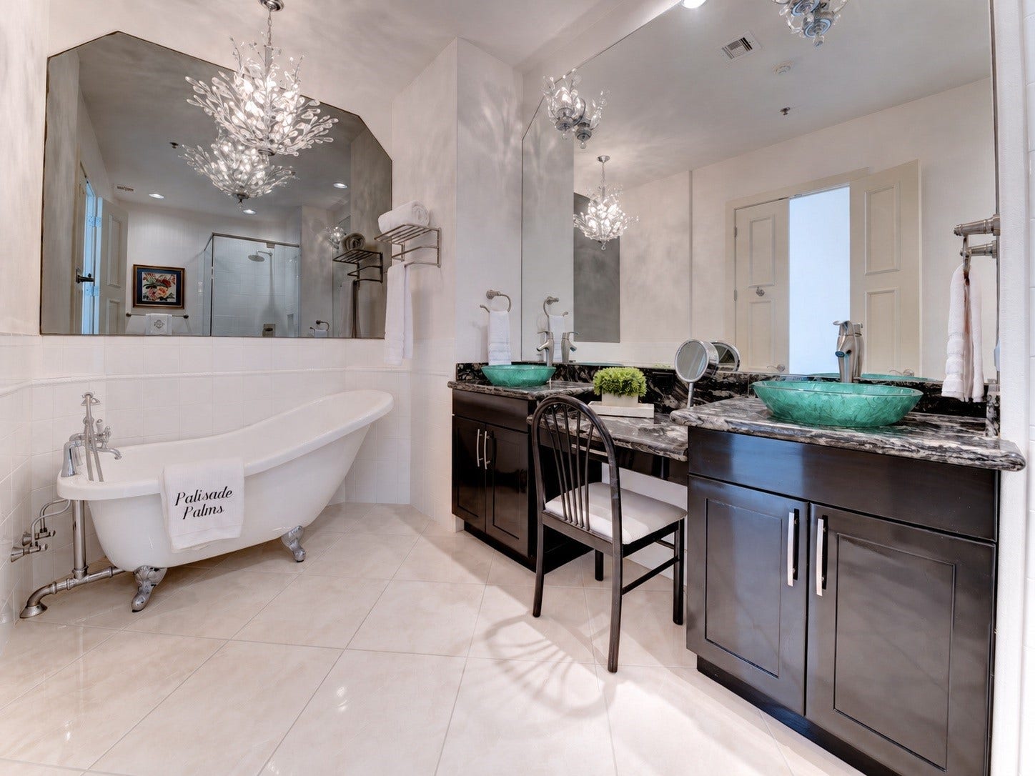 801 E Beach Drive, #BC2808, Galveston, TX 77550 Spacious second primary bath features a claw-foot tub, dual vanities, makeup area and dramatic crystal lighting