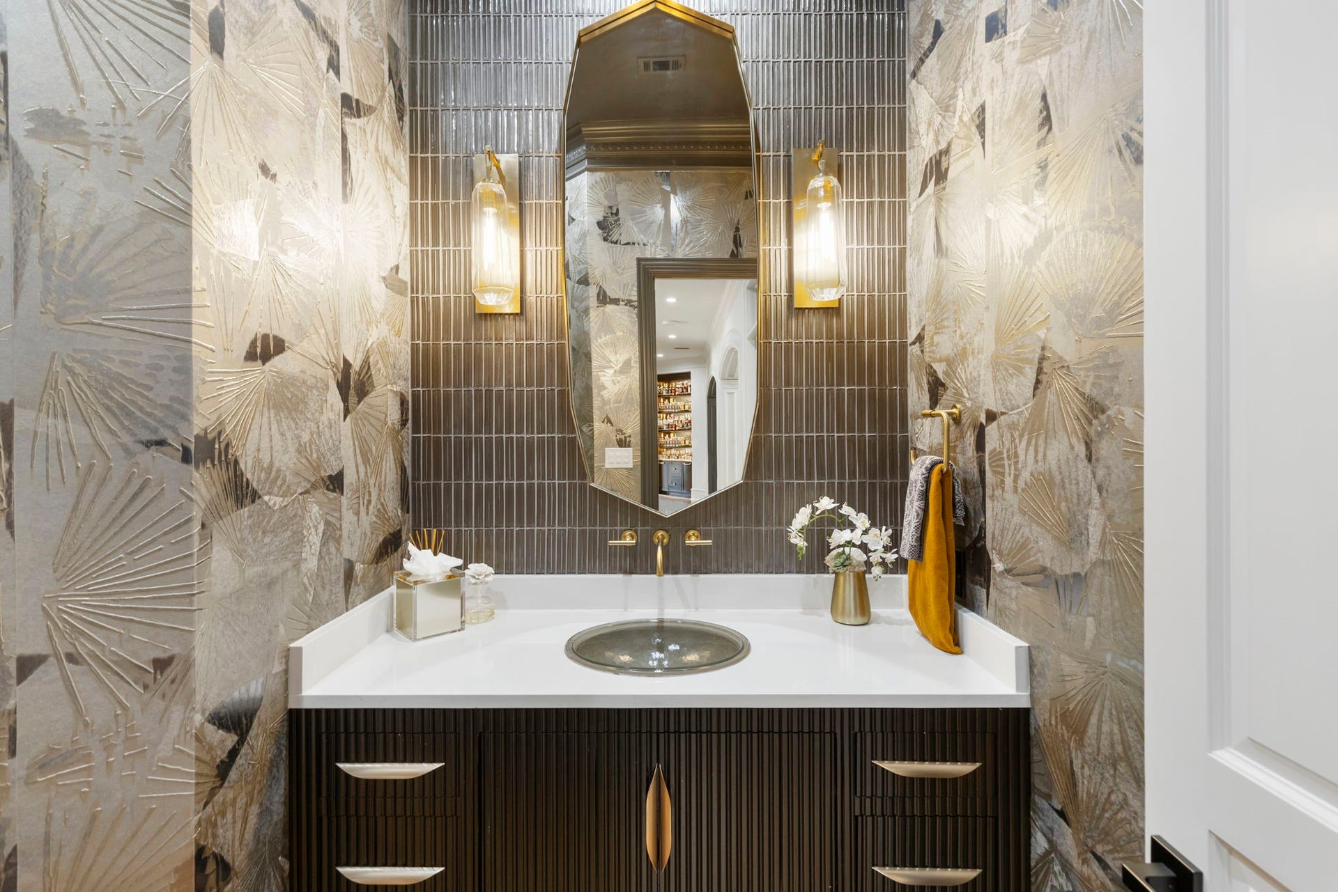 Formal powder room showcases the home's elegant attention to detail.