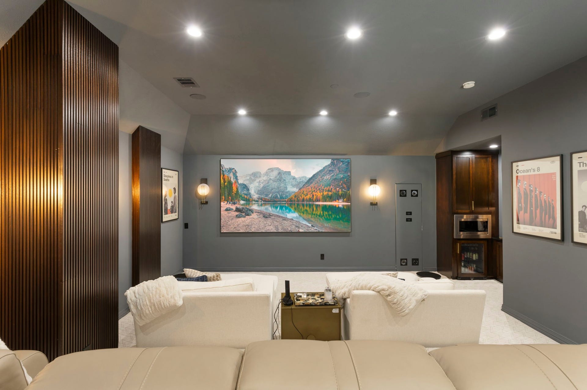 Sit back, relax and enjoy the show! A kitchenette provides convenient microwave, drink fridge and serving/storage space.
