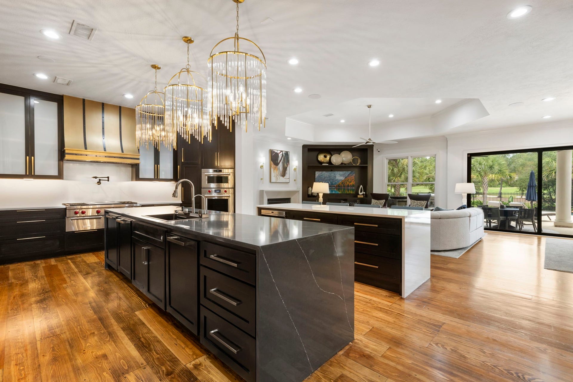 Overlooking the family room, the kitchen also highlights double islands, 2 dishwashers, Sub-Zero fridge, Wolf double ovens, convection steam oven and microwave drawer.