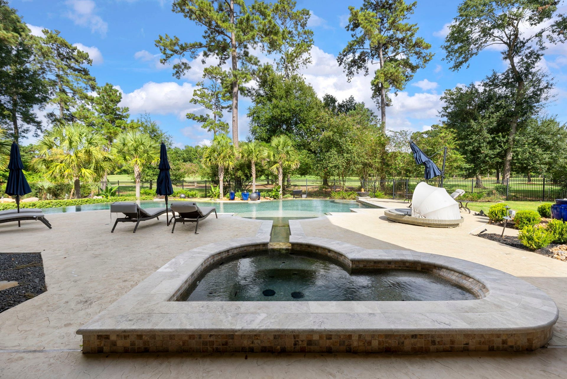 The backyard was completely redesigned: upgraded pool filtration, pumping and heating system with control panel, upgraded irrigation and drainage, low-voltage landscape lighting, and extensive mature plantings.