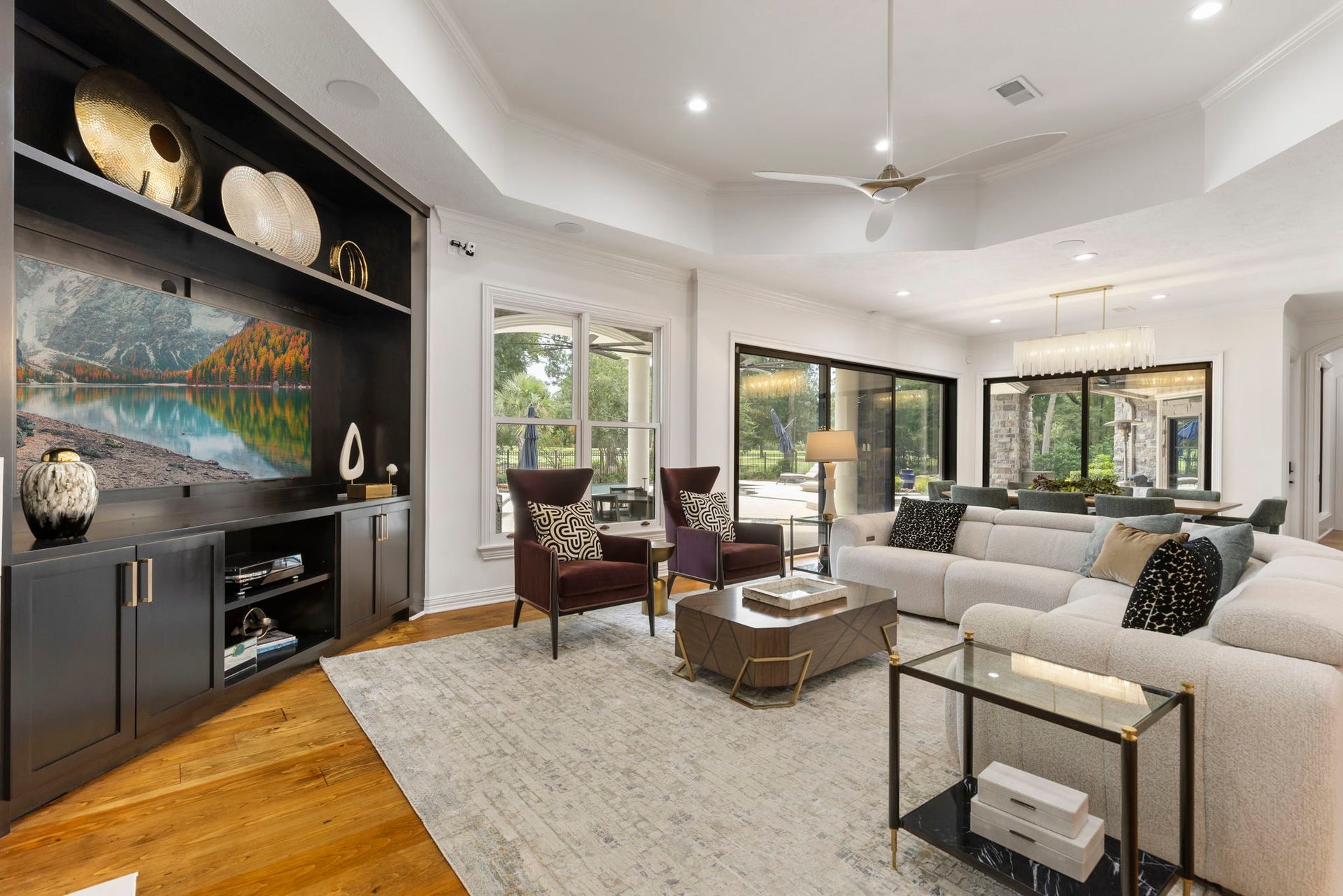 Another view of the family room highlights window and sliding glass doors that open and expand the home's entertaining.