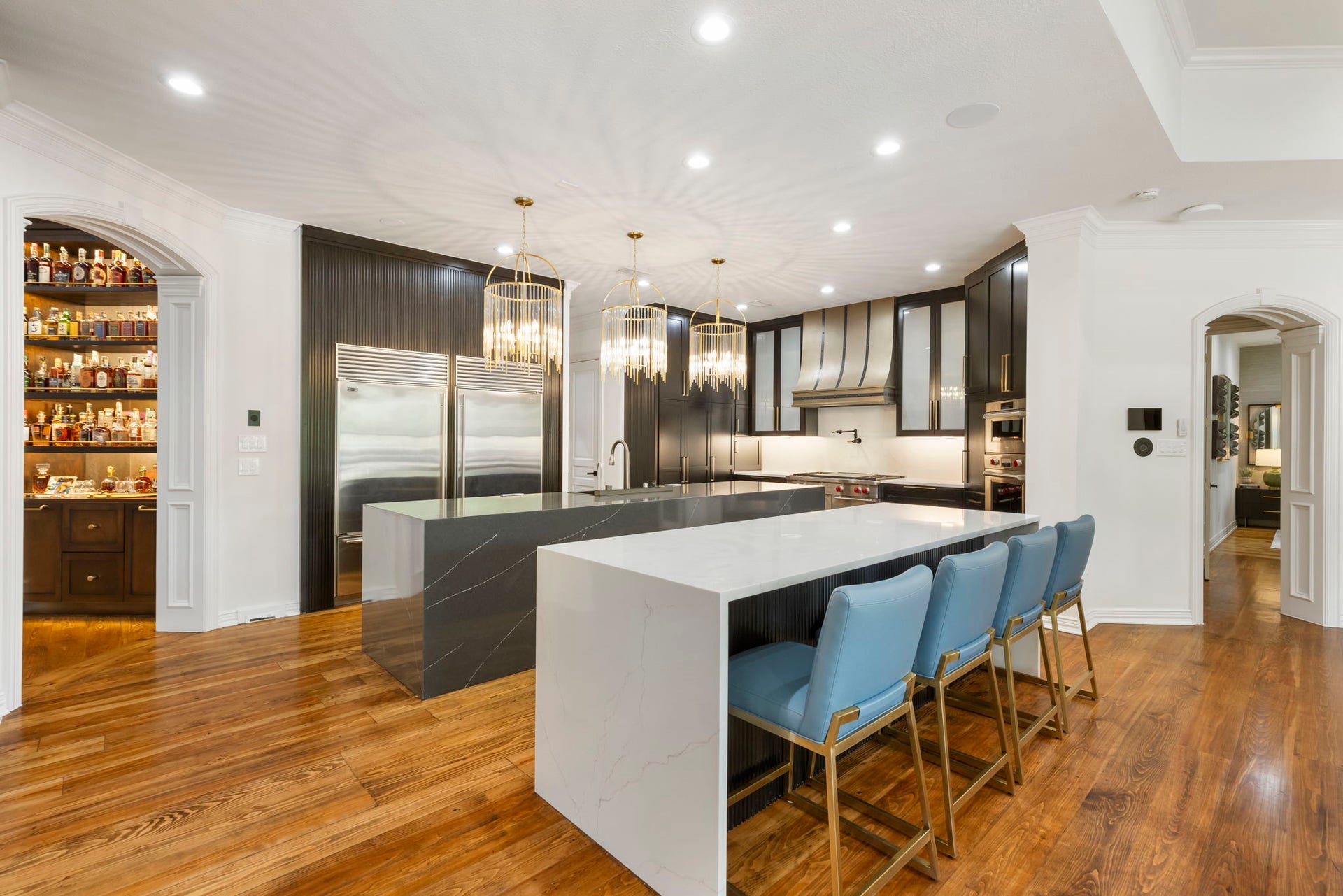 Just around the corner from the formal living spaces, an incredible entertaining kitchen enjoys all the bells and whistles!