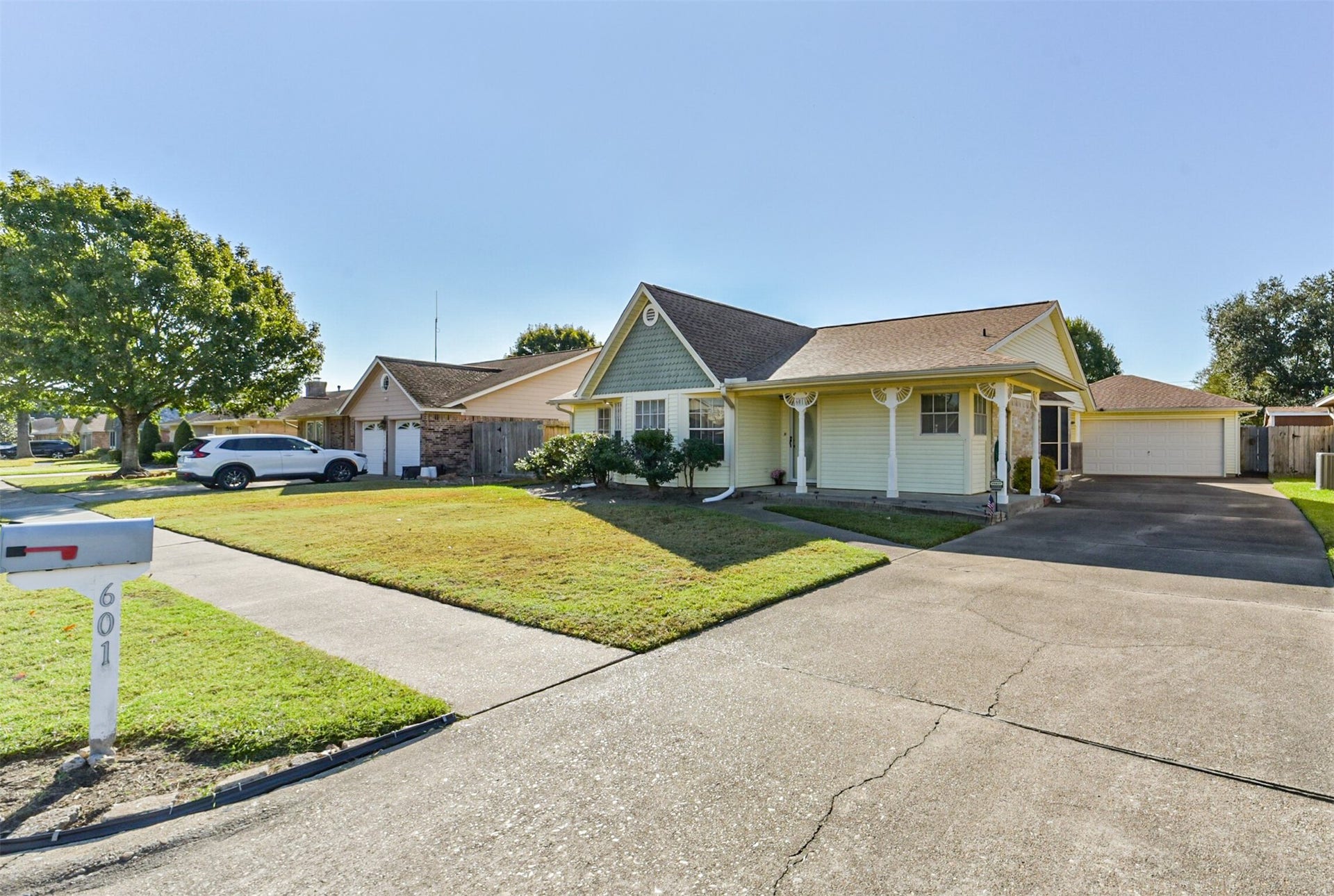 601 Kimswick C Court, Deer Park, TX 77536 From this street view, you can see the detached garage and the long driveway, which provides plenty of parking. You can also see that the other homes on this quiet street are well-maintained.