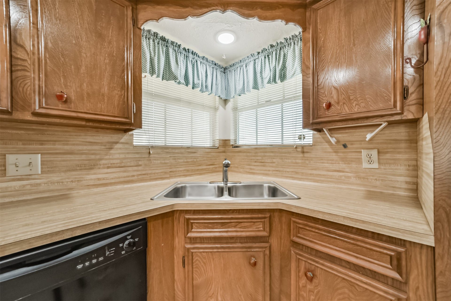 601 Kimswick C Court, Deer Park, TX 77536 Enjoy a bright, cheerful kitchen with this oversized window above the sink, filling the space with natural light while offering a lovely view of the front yard and street beyond.