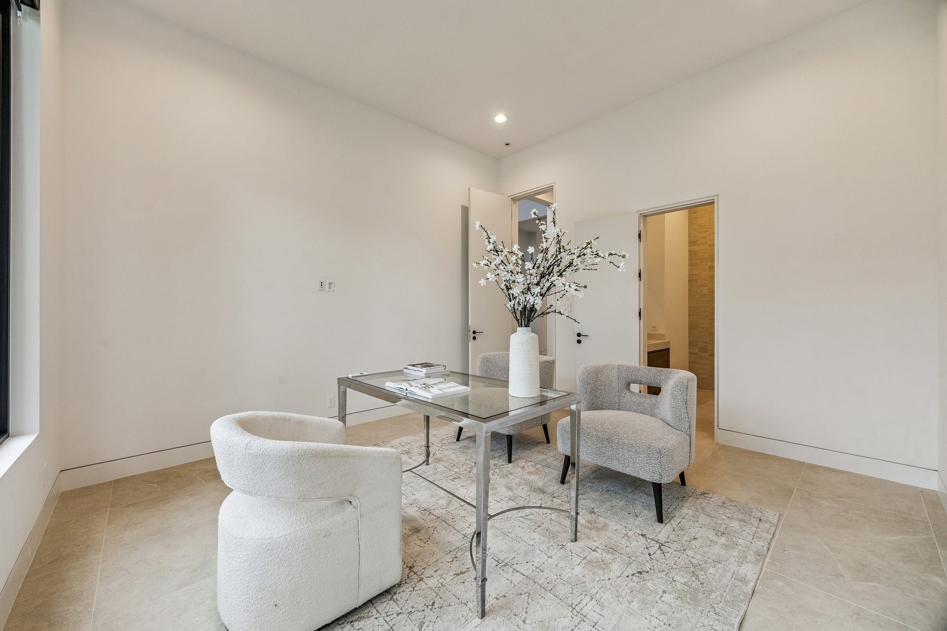 First floor guest suite, located off the entry, could also be a study
