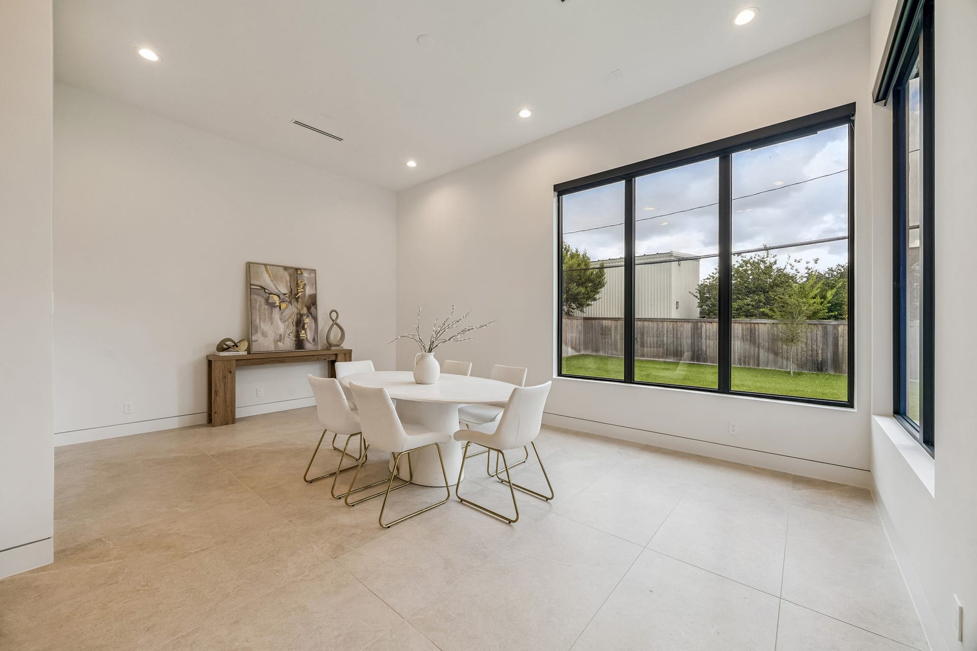 The dining area has large windows over looking the back yard.