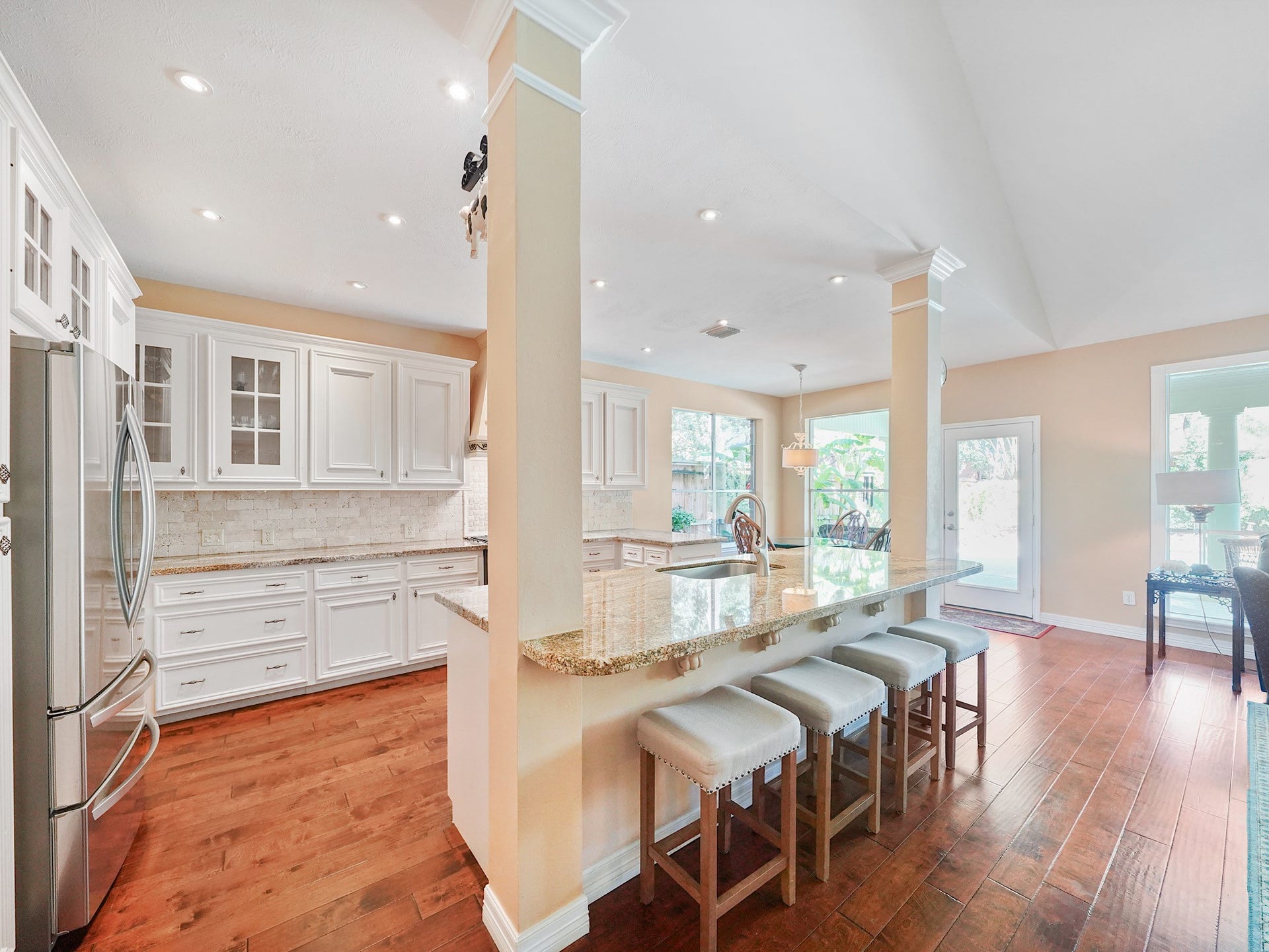 22510 Westenfield Lane, Katy, TX 77450 Pull up a seat at the breakfast bar for morning coffee, an afternoon snack, or conversation while dinner comes together. Its connection to the family room makes gathering feel effortless.