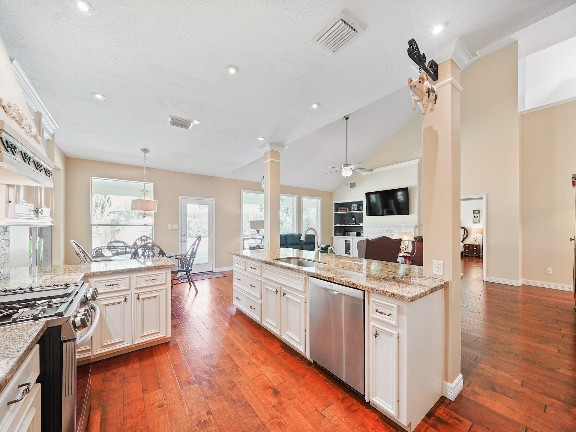 22510 Westenfield Lane, Katy, TX 77450 A gas range, plentiful cabinetry, and room to prep make this kitchen as practical as it is inviting. The open setting keeps the cook connected to the surrounding living and dining areas.