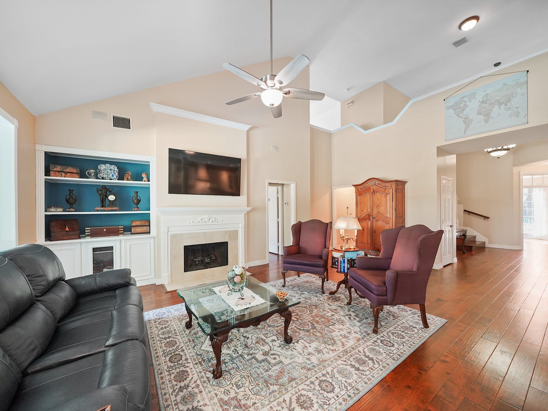 22510 Westenfield Lane, Katy, TX 77450 A fireplace creates a cozy focal point in the family room, with built-in shelving nearby to display favorite books and keepsakes. Imagine winding down here at the end of the day.