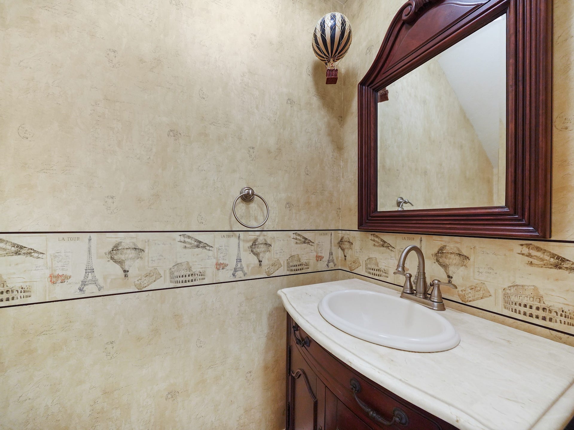 22510 Westenfield Lane, Katy, TX 77450 The downstairs powder room is conveniently located for guests and everyday use, with decorative details that give the space its own personality.