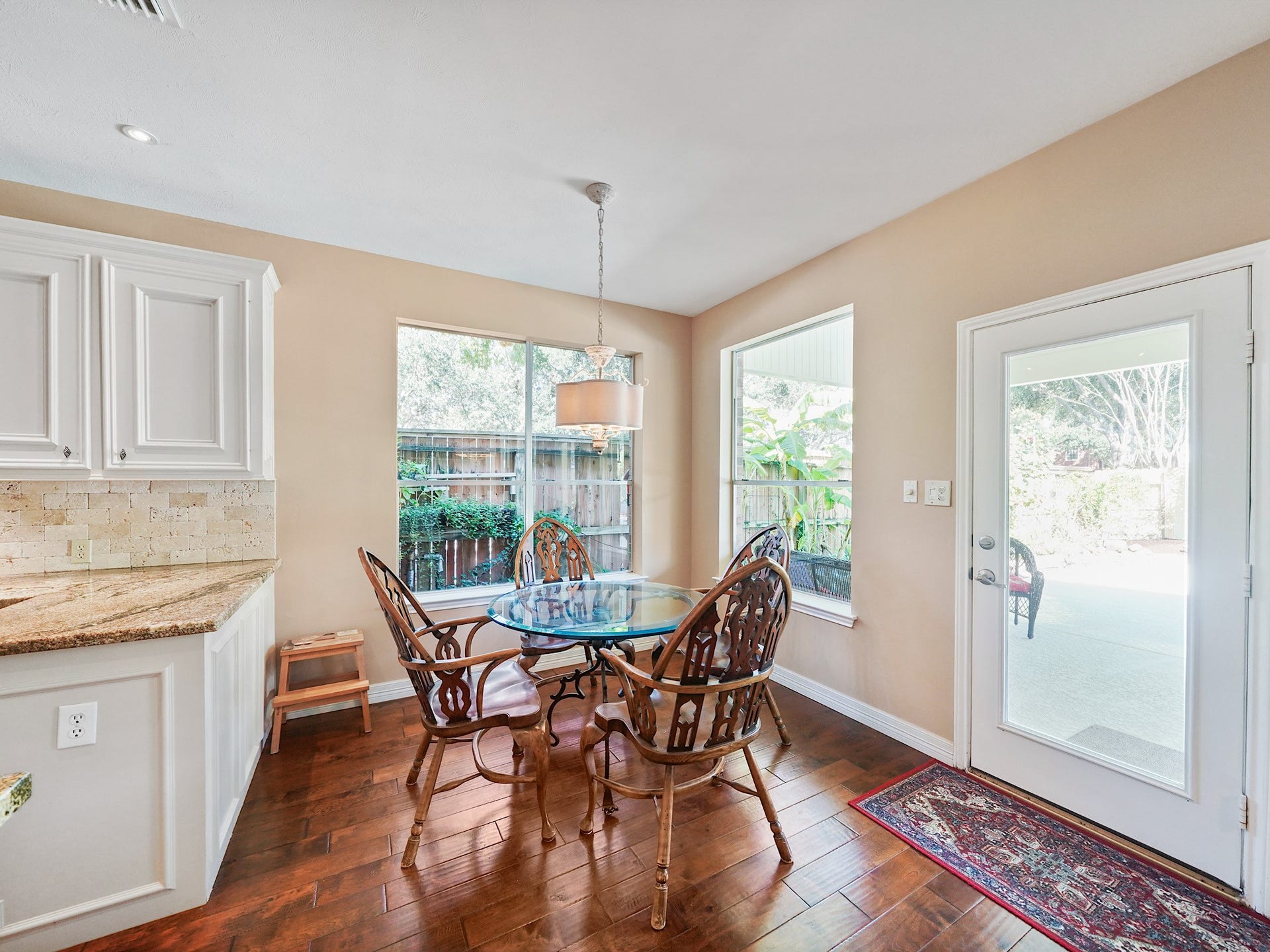 22510 Westenfield Lane, Katy, TX 77450 Surrounded by windows, the breakfast room is a cheerful spot to begin the morning. A nearby door leads toward the backyard, making it easy to carry meals and conversation outside.