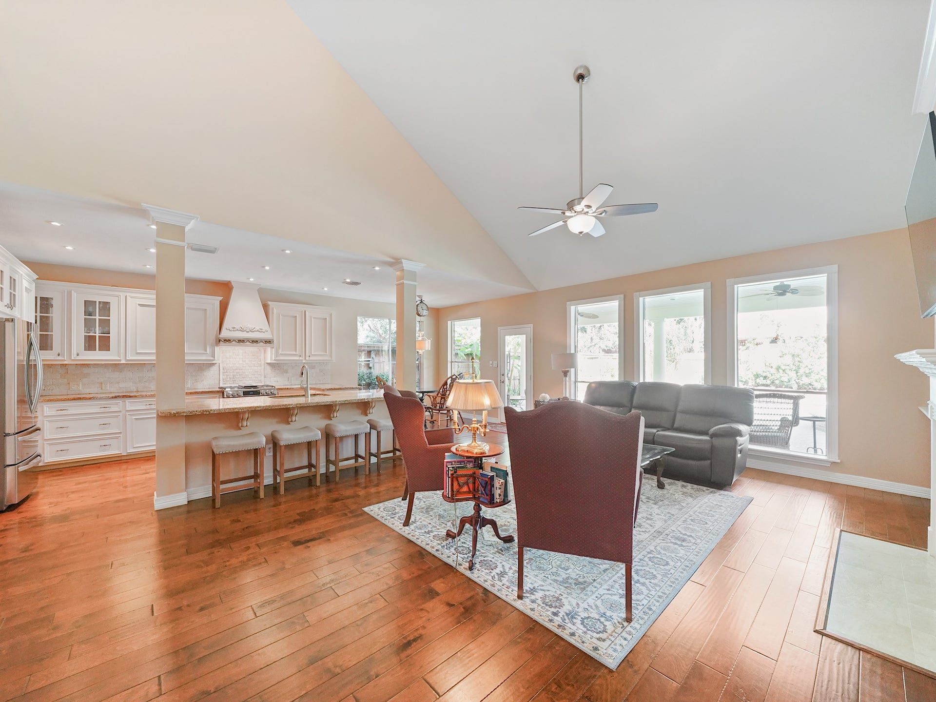 22510 Westenfield Lane, Katy, TX 77450 The family room welcomes you with an open layout, warm wood flooring, and a seamless connection to the kitchen. Gather here for relaxed evenings while enjoying a view of the backyard.