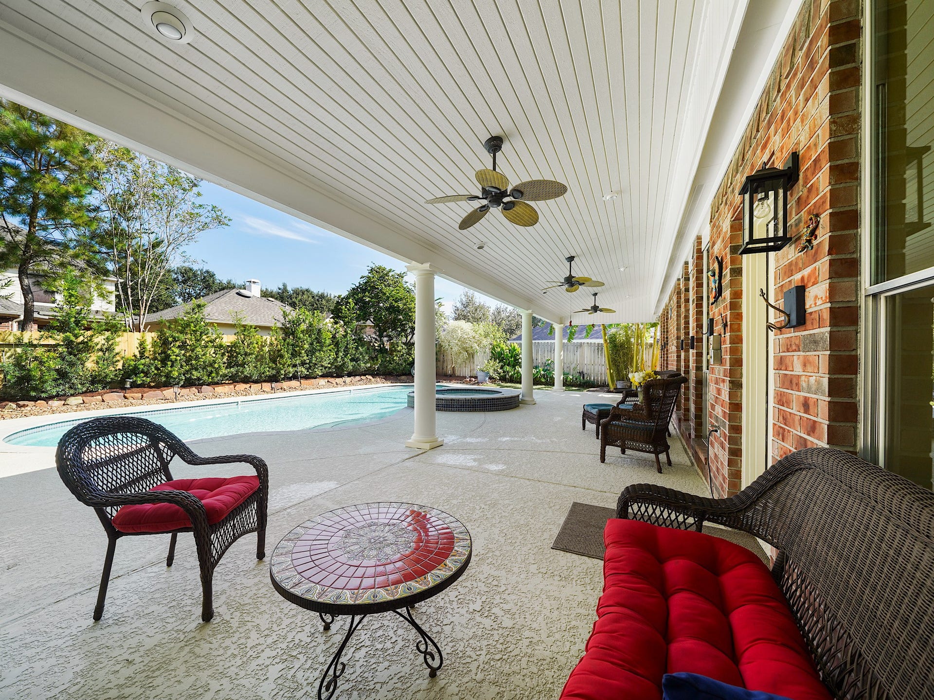 22510 Westenfield Lane, Katy, TX 77450 The huge covered patio invites you to slow down and enjoy the outdoors, whether youre sipping your morning coffee or visiting with friends after a swim. Ceiling fans help keep the shaded gathering space comfortable.