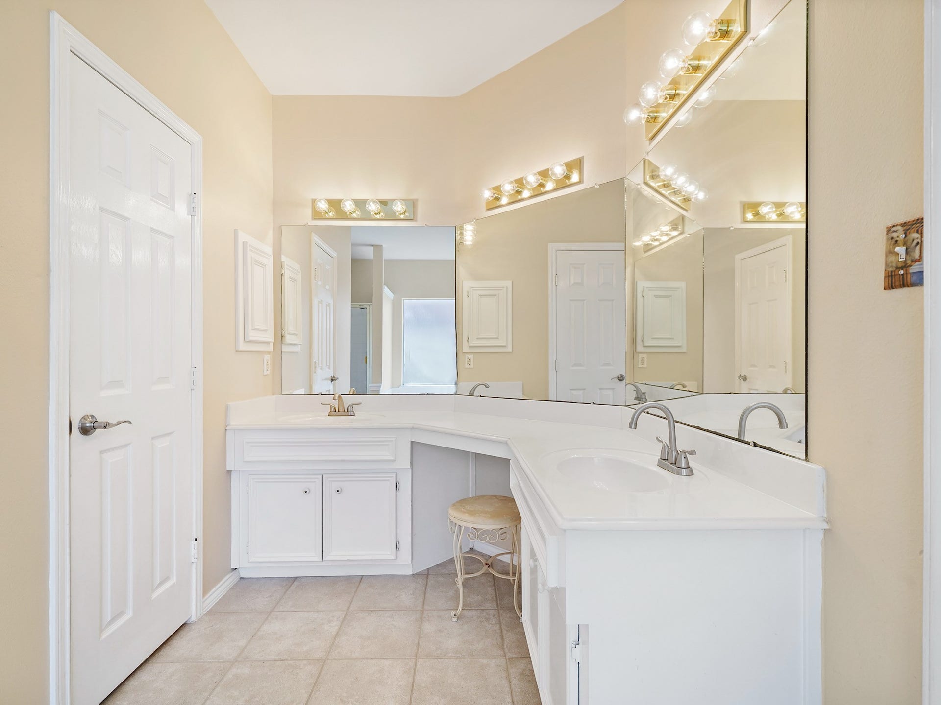 22510 Westenfield Lane, Katy, TX 77450 An extended dual-sink vanity provides plenty of room for daily routines, with cabinet storage and a seated vanity area. Everything has its place in this bright and spacious bath.