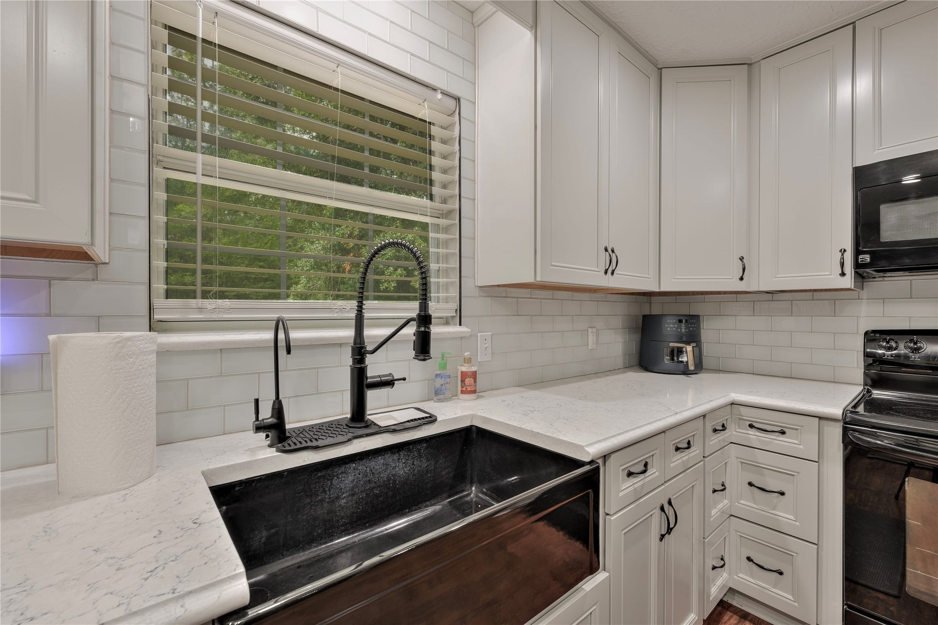 Kitchen sink with a view of the backyard.
