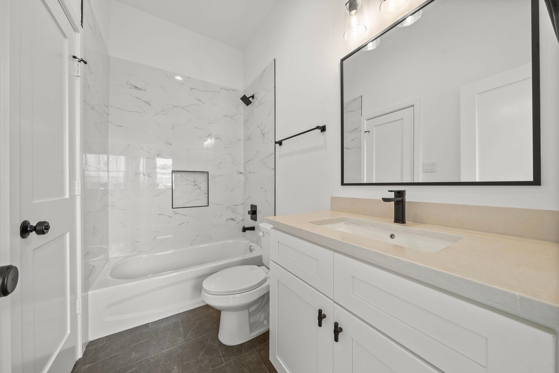 Full bathroom located off the flex room. This also serves as the guest bathroom.