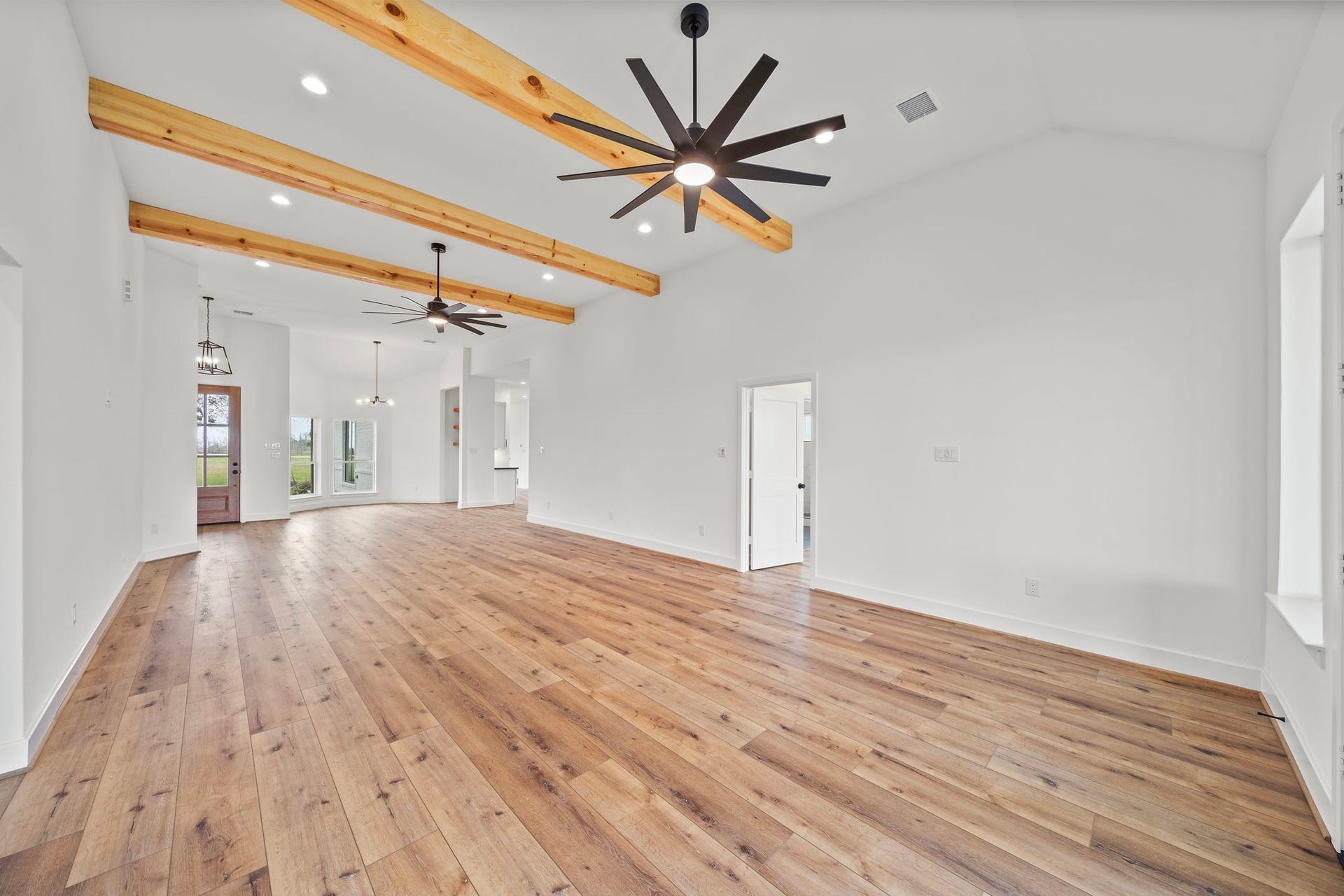 Wood beams and new light fixtures throughout the home.
