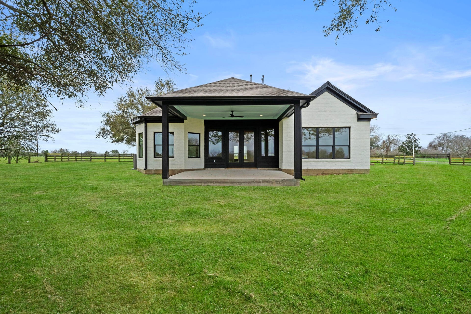 This covered back porch is perfect for evening enjoyment!