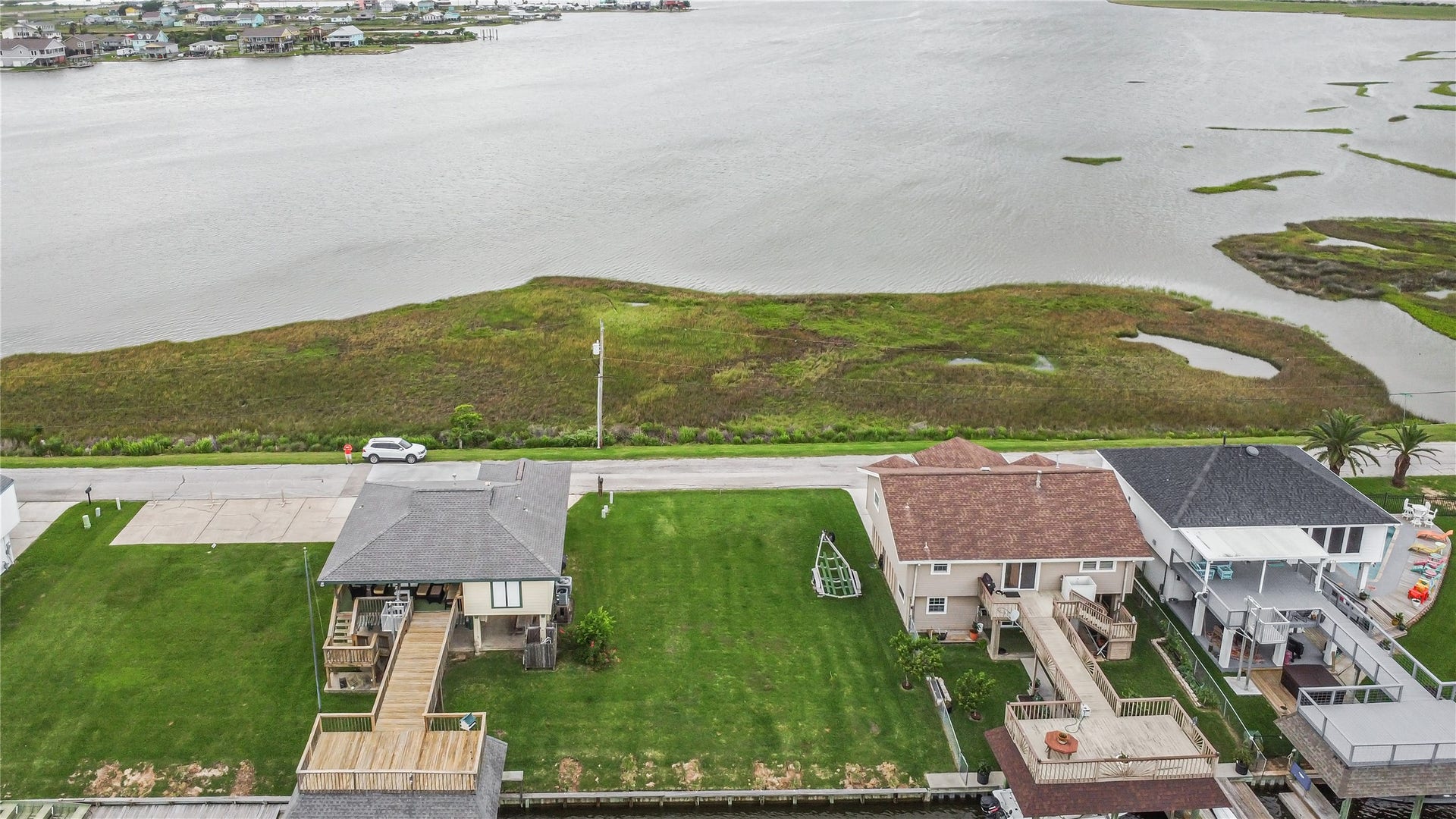 3 N White Heron Drive, La Marque, TX 77568 Lot is on the right side with a view of the bayou.