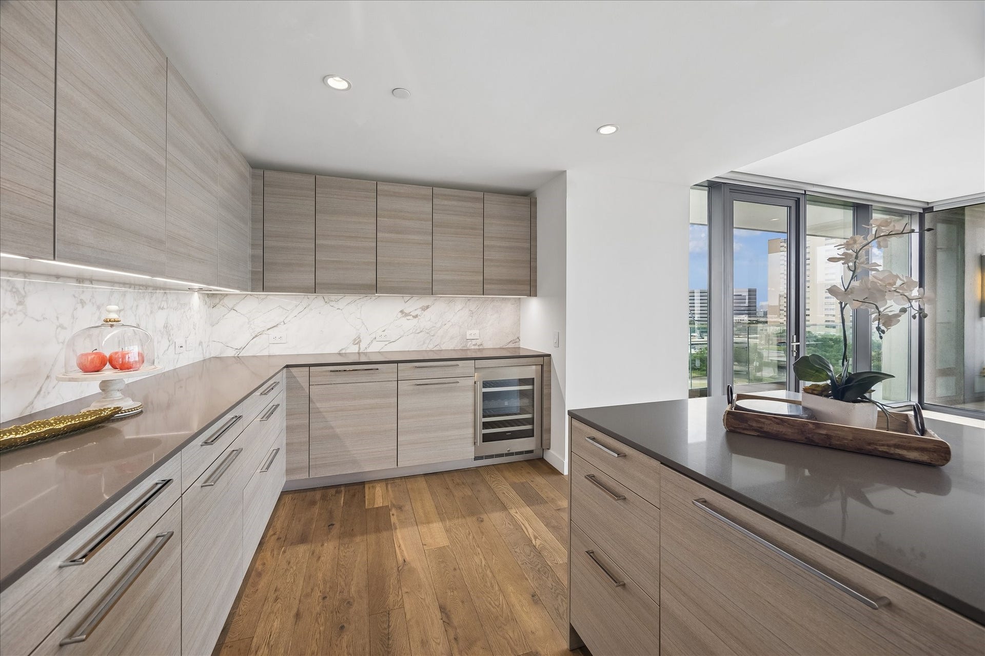 3433 Westheimer Road, #702, Houston, TX 77027 A dedicated beverage station with wine storage adds both convenience and sophistication for effortless entertaining.