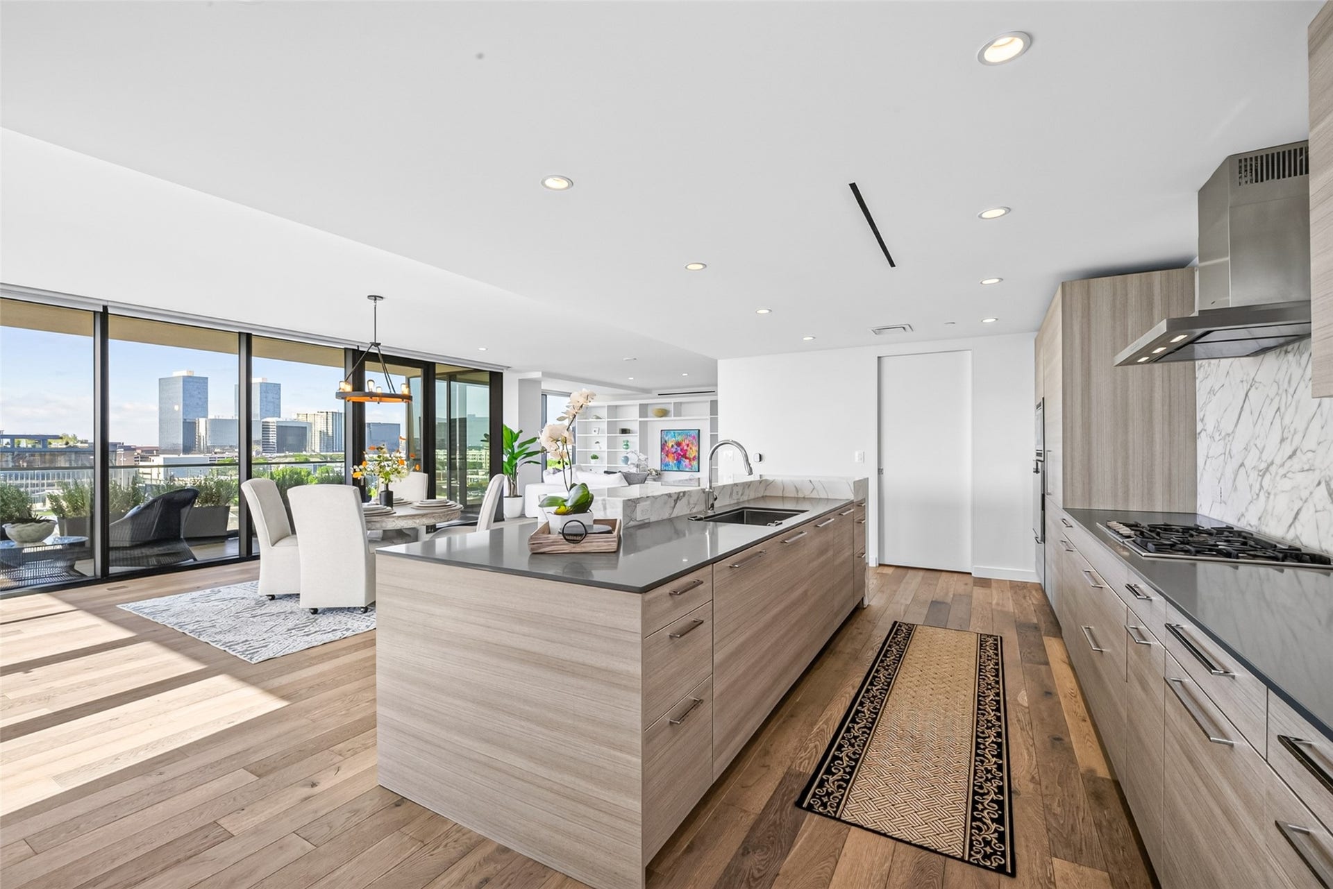3433 Westheimer Road, #702, Houston, TX 77027 The chef's kitchen features designer Poggenpohl cabinetry integrating the appliances, and Calacatta marble back splash curated for the discerning culinary enthusiast.
