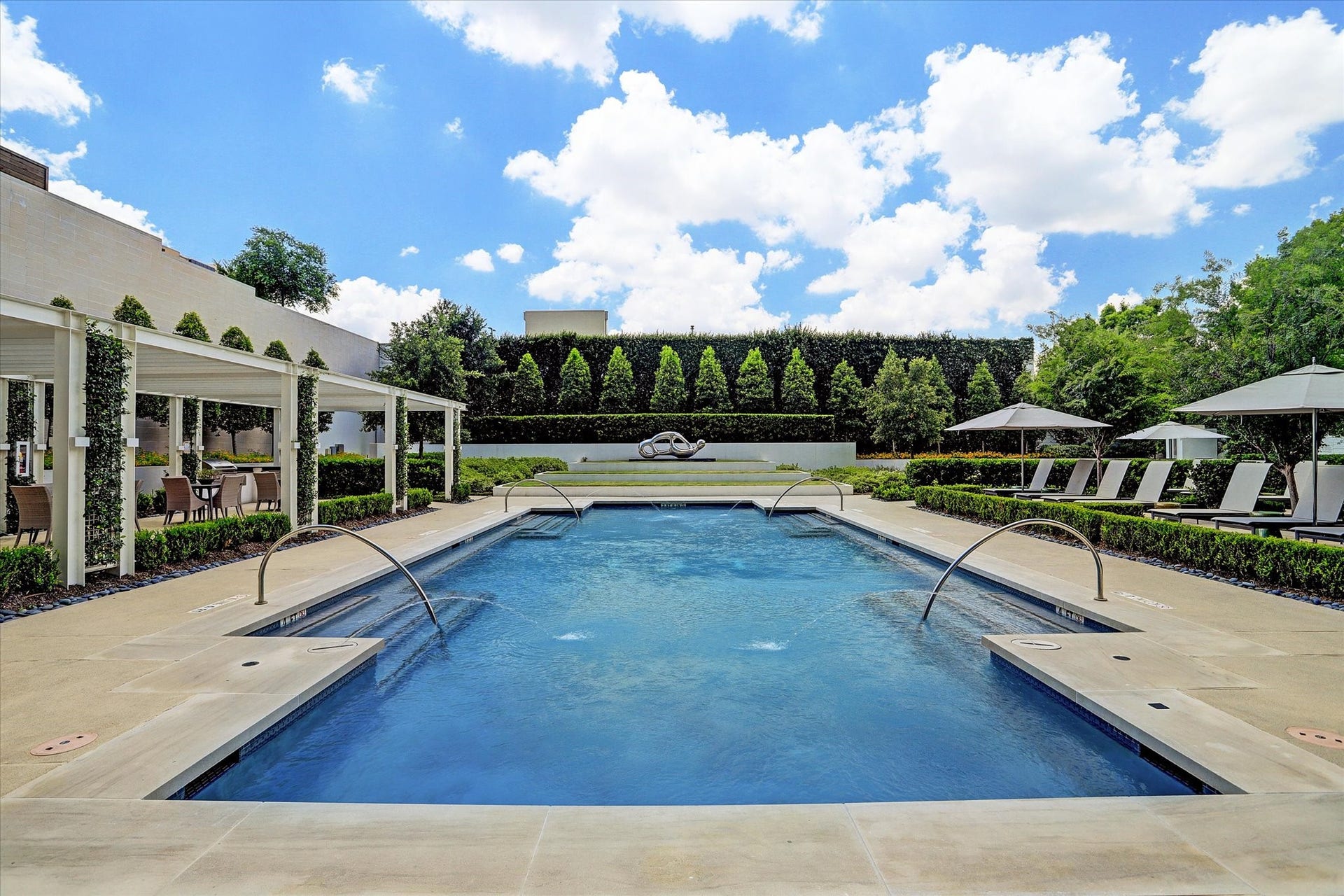 3433 Westheimer Road, #702, Houston, TX 77027 Resort-inspired pool surrounded by lush landscaping, cabanas, and inviting spaces to unwind year-round.