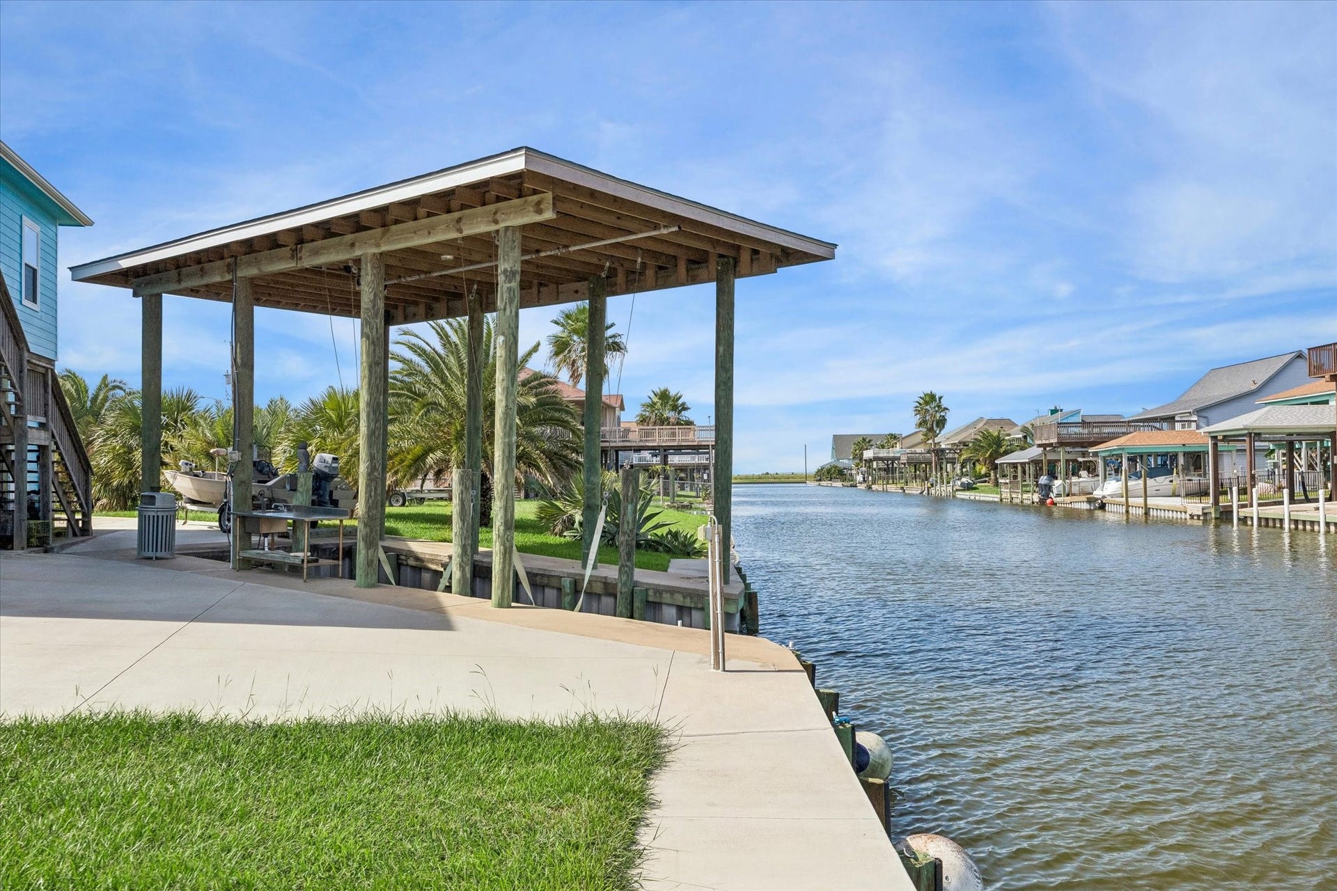161 Four Master Road, Freeport, TX 77541 Waterfront oasis with a private covered boat dock overlooking a serene canal, perfect for boating enthusiasts and nature lovers.