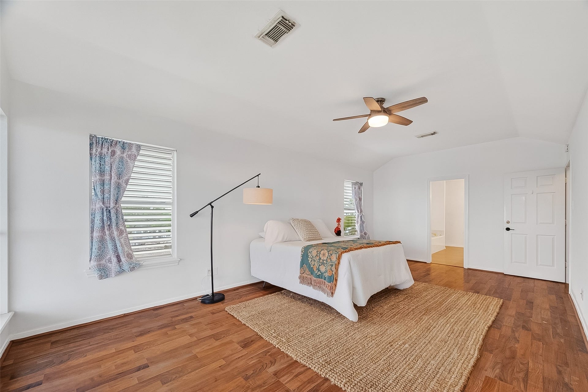 925 Bonita Street, Bayou Vista, TX 77563 Tons of natural light in the primary bedroom! Here is Looking towards the ensuite bathroom and walk in closet