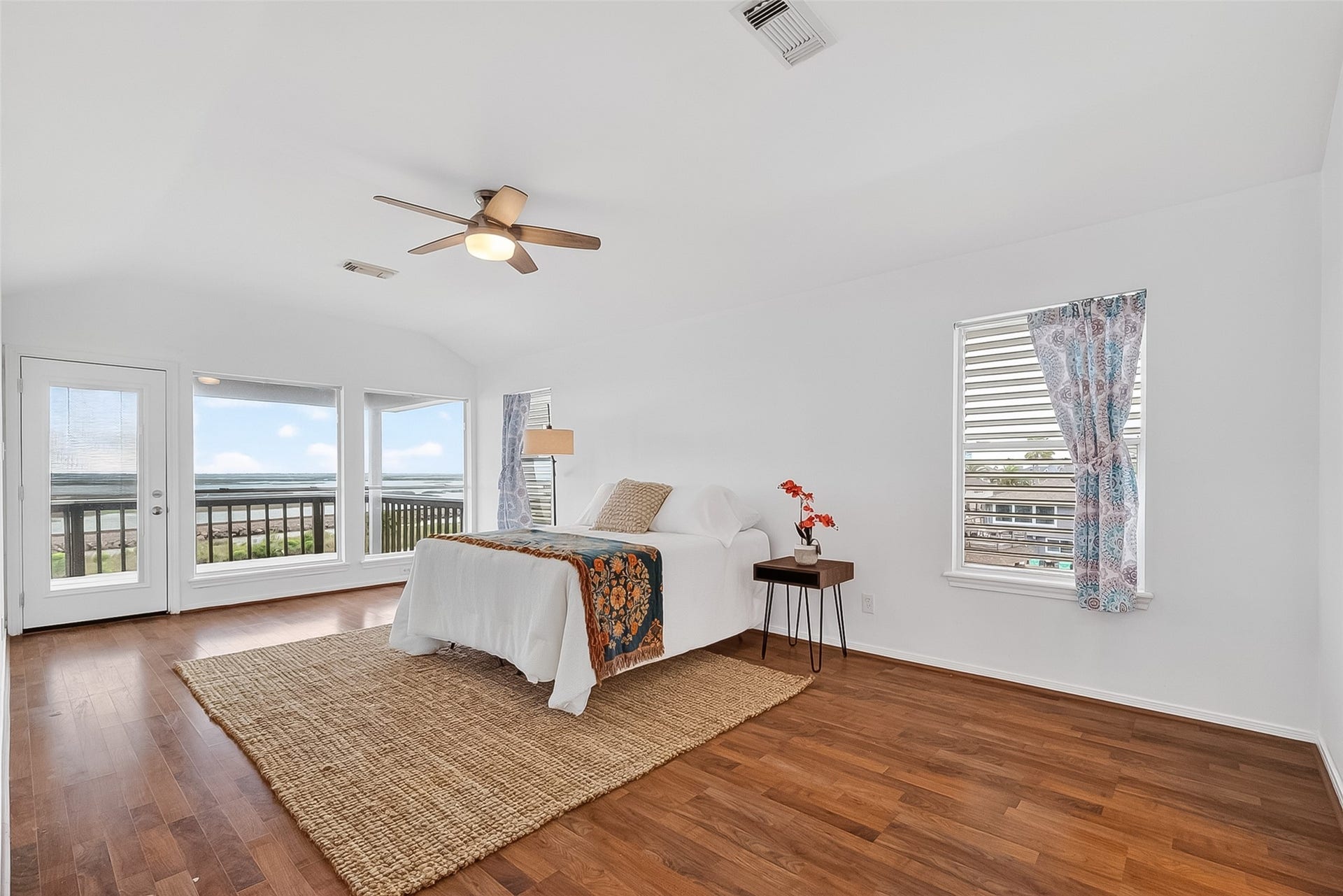 925 Bonita Street, Bayou Vista, TX 77563 Primary bedroom with AMAZING view and secluded balcony, as well as walk in closet and en-suite bathroom! CAN YOU IMAGINE WAKING UP TO THIS VIEW EVERYDAY?