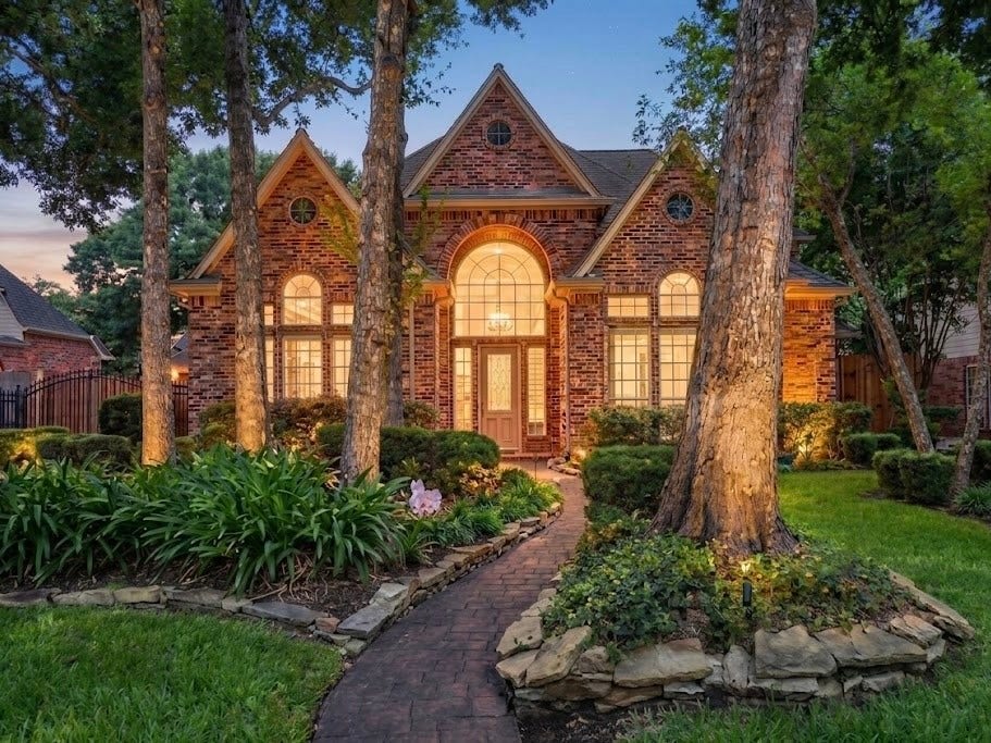 3411 Fir Forest Drive, Spring, TX 77388 Beautiful custom home featuring a stamped concrete pathway leading up to the front door.