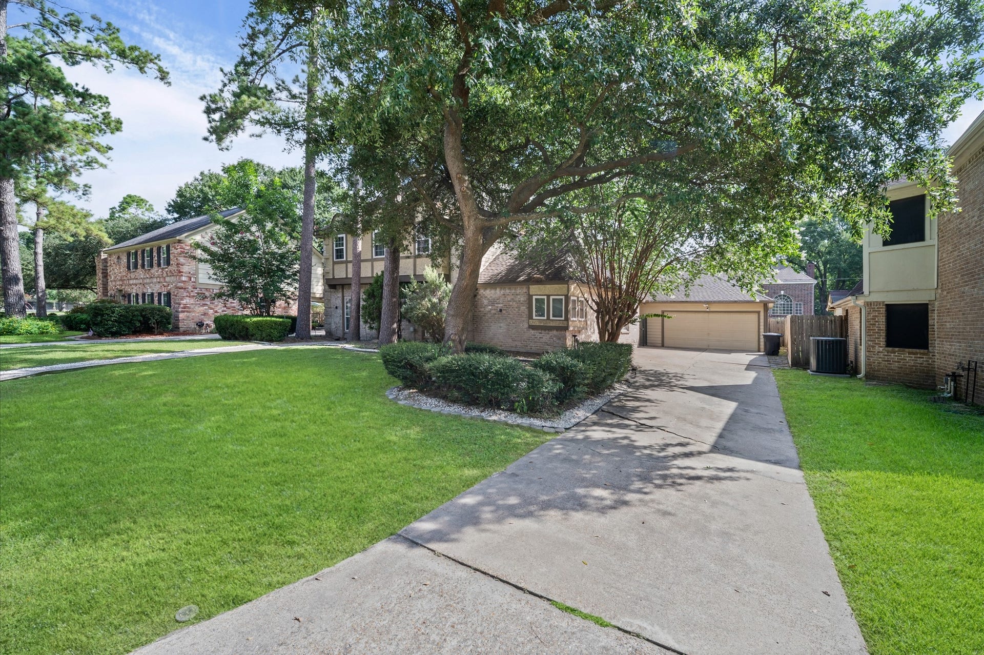 13126 Lemur Lane, Cypress, TX 77429 A massive front lawn and extra long driveway greets you.