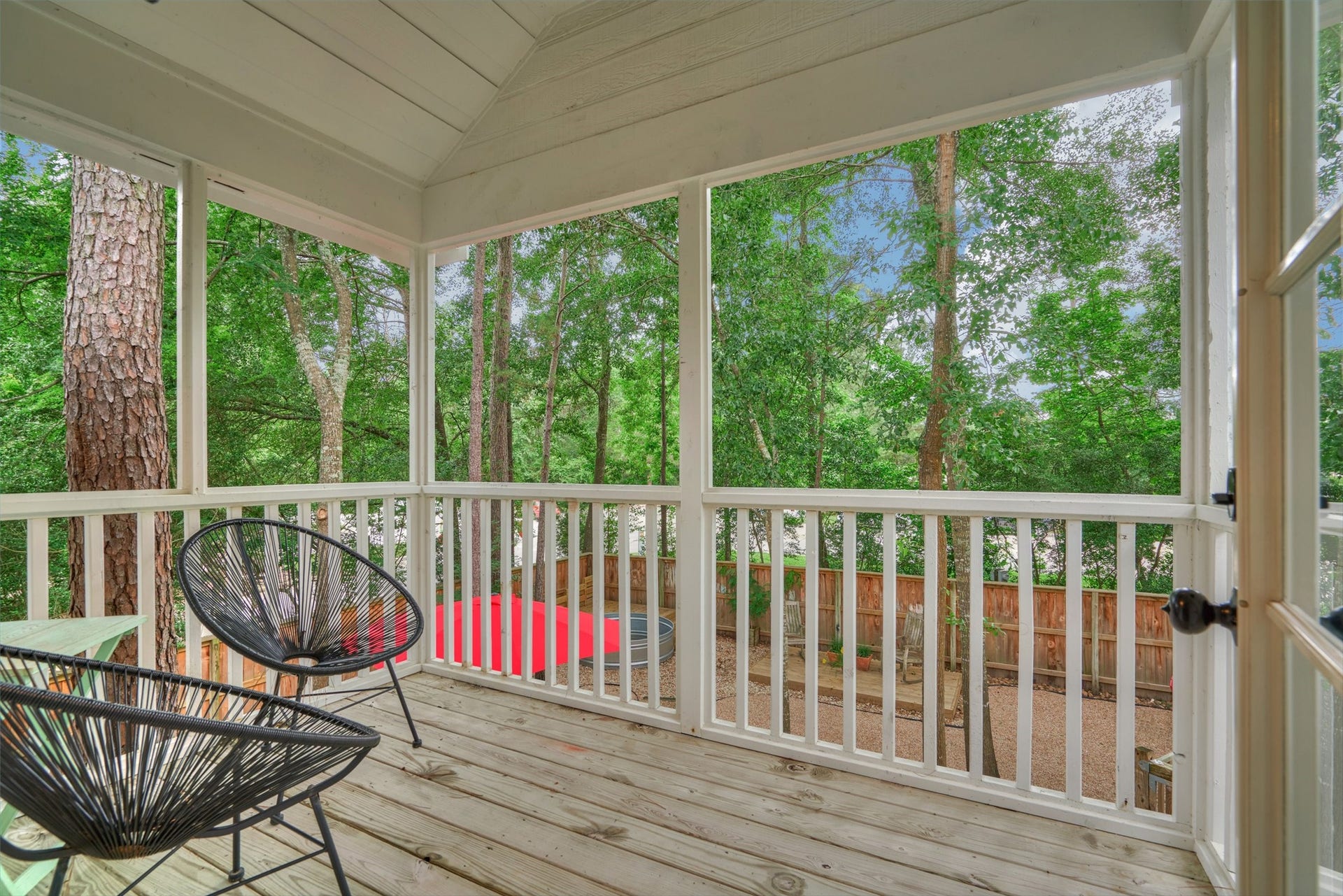 38 E Gaslight Place, The Woodlands, TX 77382 The balcony off the primary bedroom upstairs. Sit and enjoy the tranquil space amongst the trees!
