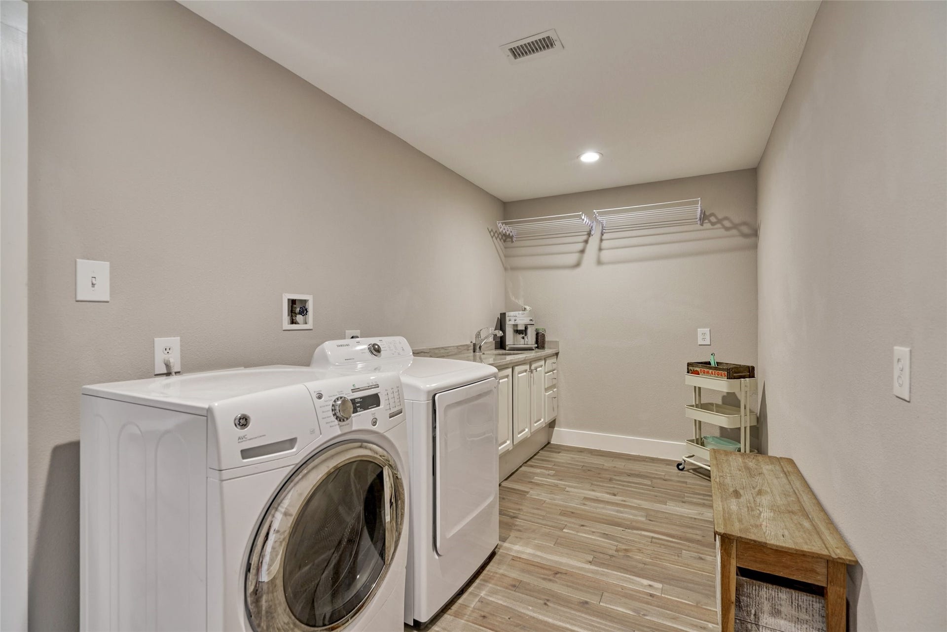 38 E Gaslight Place, The Woodlands, TX 77382 The HUGE laundry room can really be a multi purpose space. There is lots of additional storage, a second sink and washer and dryer are included!