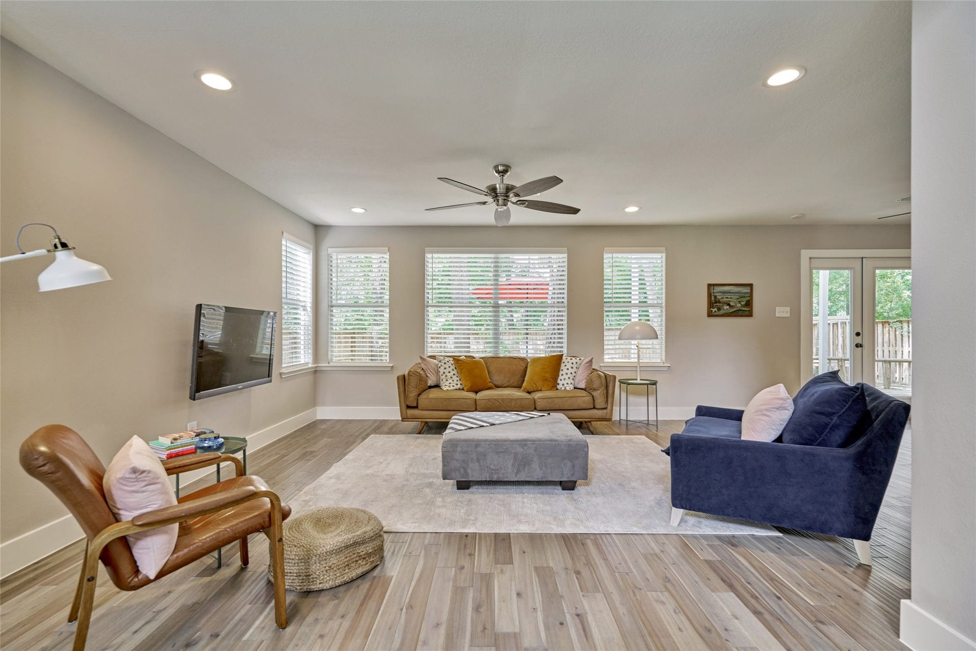 38 E Gaslight Place, The Woodlands, TX 77382 The Family room is very spacious with a wall of windows to the rear.