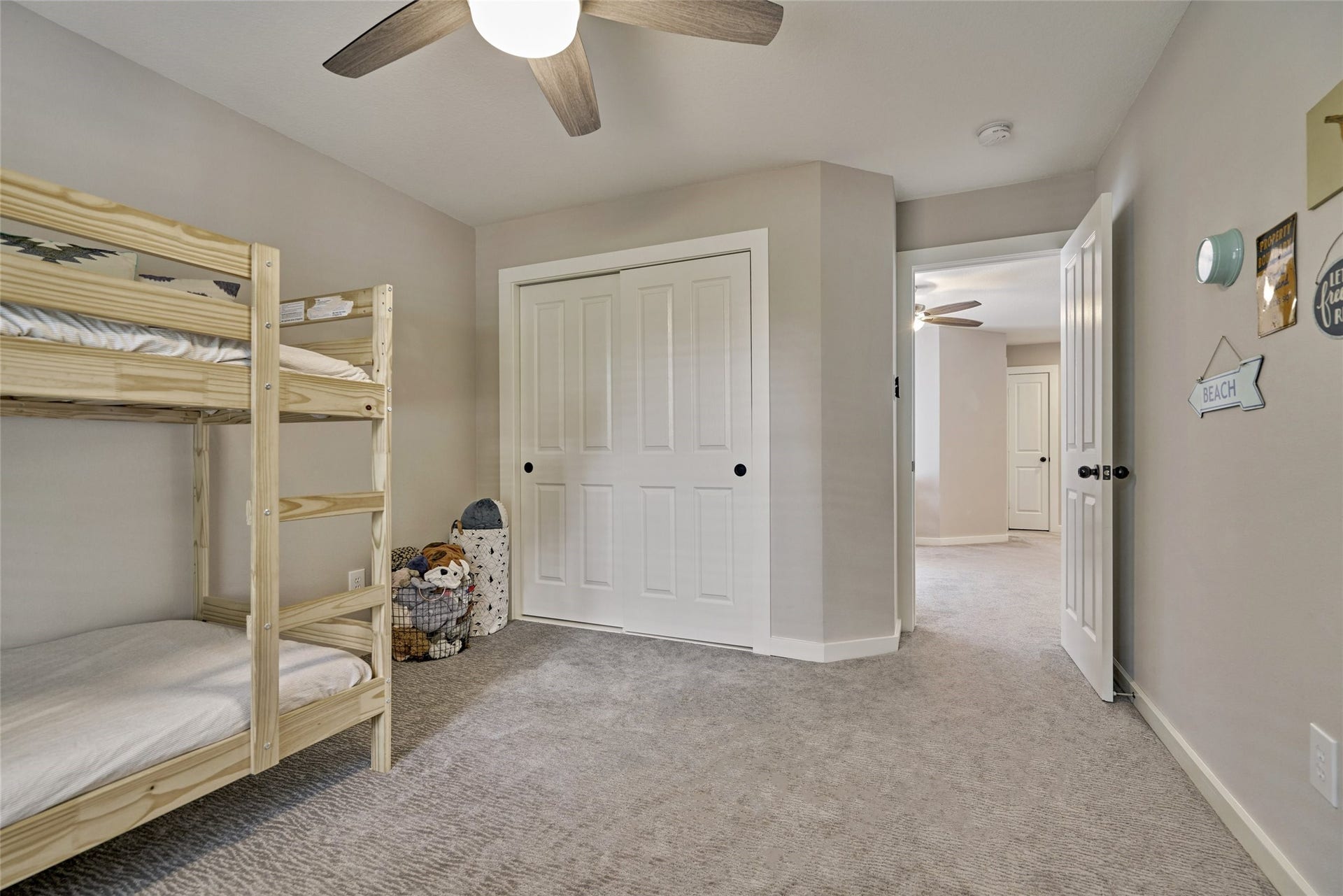 38 E Gaslight Place, The Woodlands, TX 77382 One of the secondary bedrooms up. All bedrooms have good sixed closets. The home has lots of storage space.