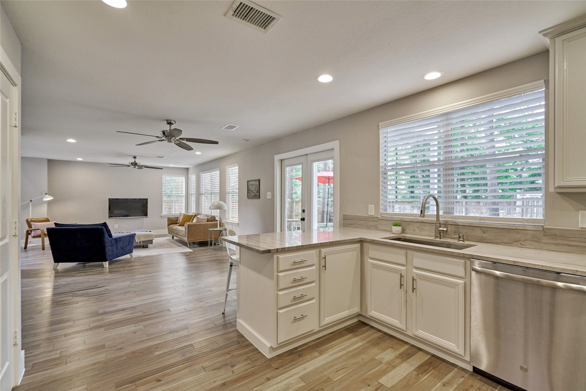 38 E Gaslight Place, The Woodlands, TX 77382 The home has an open concept design throughout the 1st floor. The french doors from the breakfast room lead you out onto the large deck and patio.