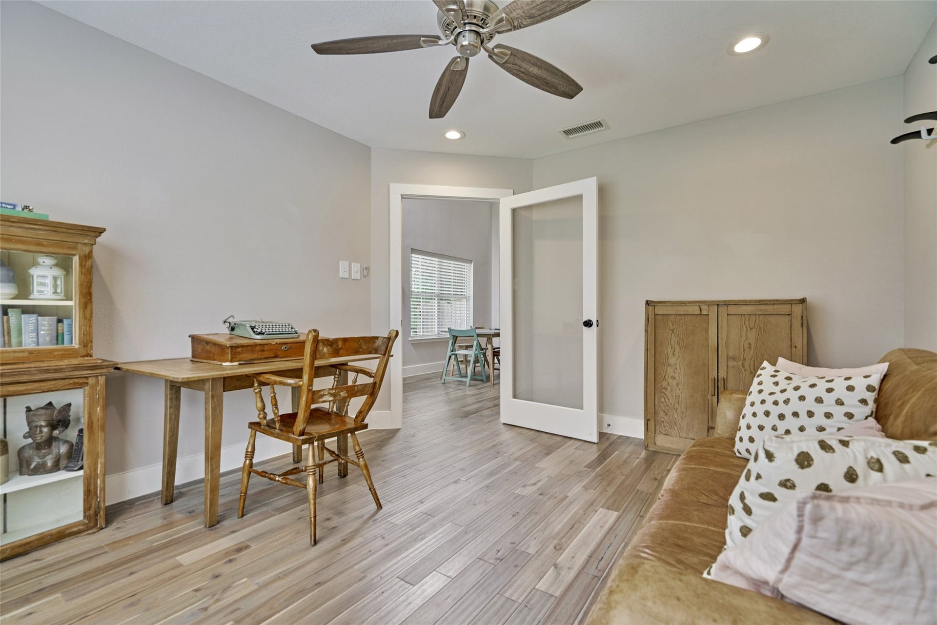 38 E Gaslight Place, The Woodlands, TX 77382 The home has a large study on the 1st floor and is light and bright! It is a wonderful space to work form home. The gorgeous flooring continues here and can also accommodate a lot of furniture. LED lighting, Upgraded remote fans and neutral decor.