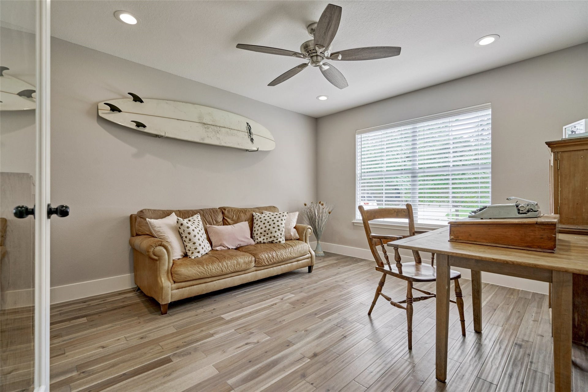 38 E Gaslight Place, The Woodlands, TX 77382 A large study is located to the front of the home. The room overlooks the front garden. The gorgeous hardwood floors add warmth to the home. All decorated in neutral paint and LED lighting with updated fans!