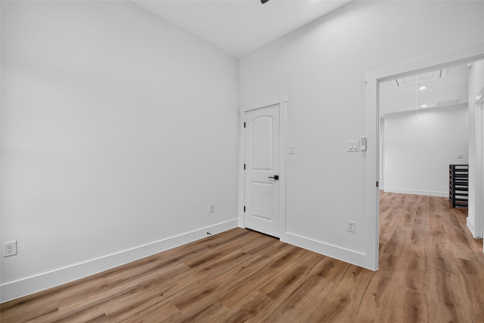 A light-filled secondary bedroom with a fresh, welcoming feel and plenty of natural lightready to serve as a bedroom, guest room, or private retreat.