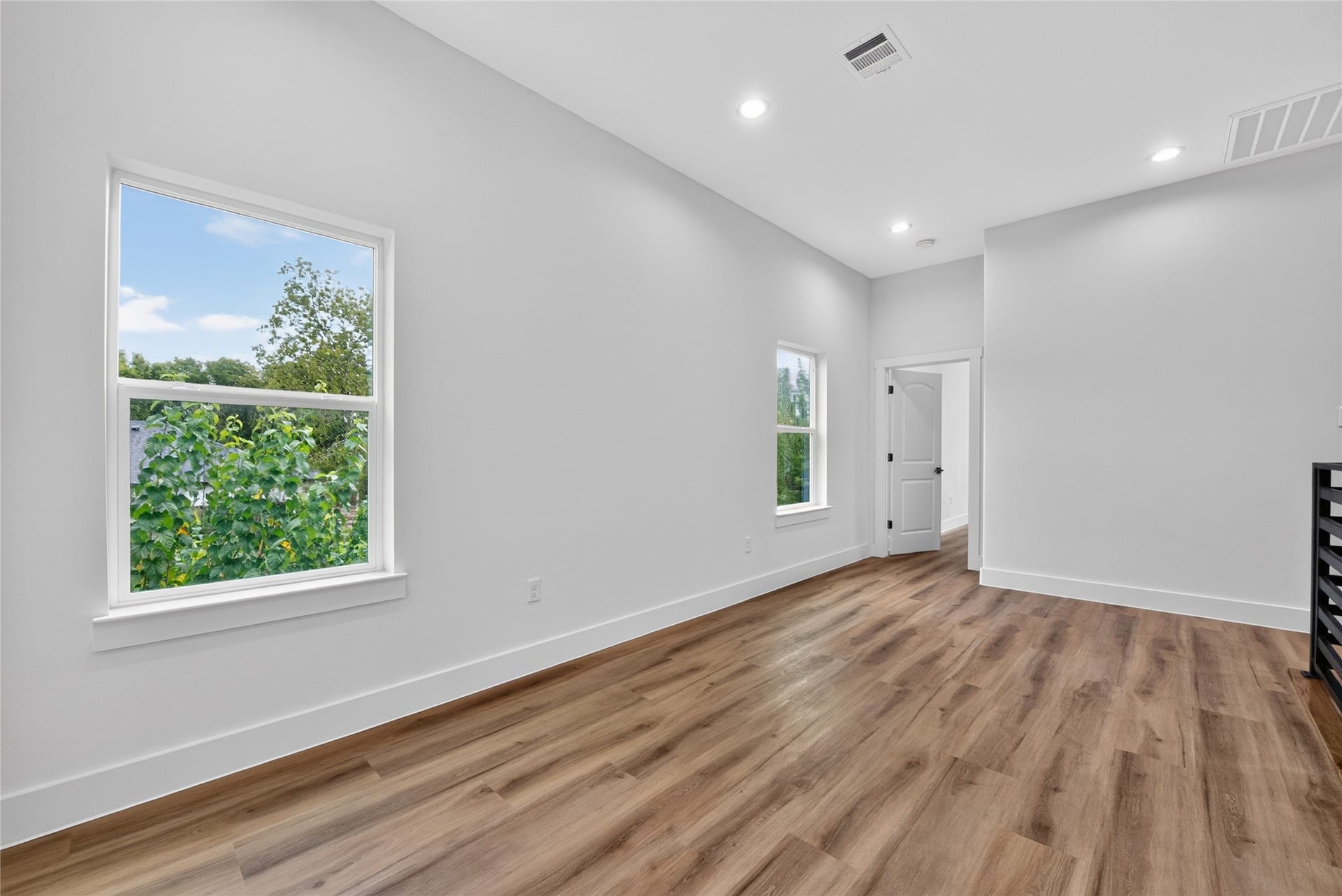 Thoughtfully separated for privacy--the primary suite is privately positioned on the opposite side of the spacious flex space, creating a desirable separation from the two secondary bedrooms and full bath.