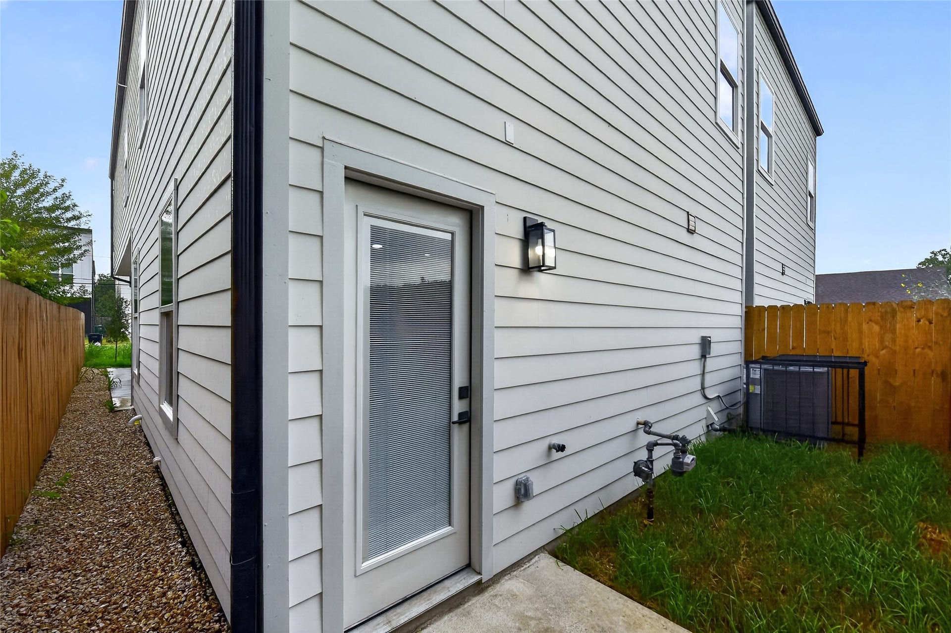 Enjoy a fenced backyard with a private green space, perfect for relaxing, entertaining, gardening, or giving your four-legged friends room to play. A little outdoor space to make your own.