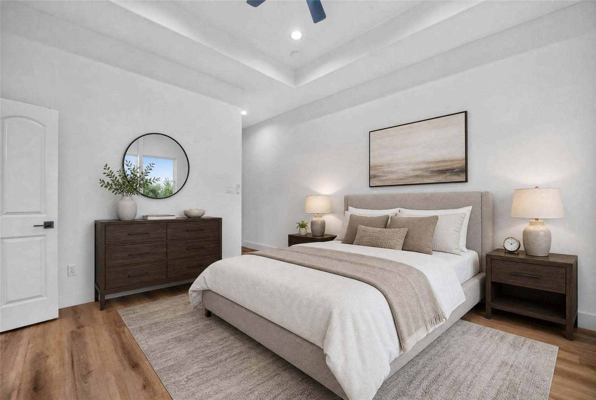 Unwind in this spacious second-floor primary suite featuring a recessed ceiling and ceiling fan, creating an airy, comfortable space to relax and recharge. Your modern retreat awaits.