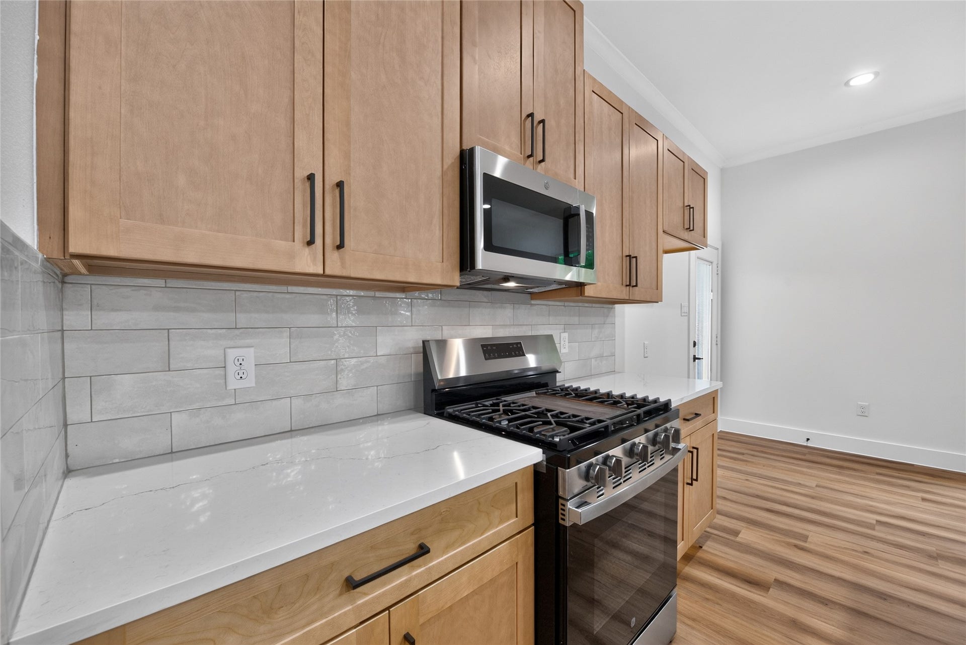 Generous counter space and abundant storage offer a polished, practical space for everyday living.