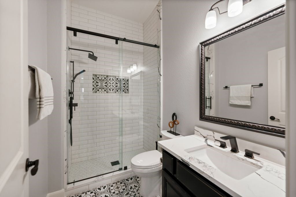 10 Camplight Court, Spring, TX 77389 Sharp full bath with shower on the first floor adjacent to the Secondary Bedroom down. 5 Bedrooms in total here.
