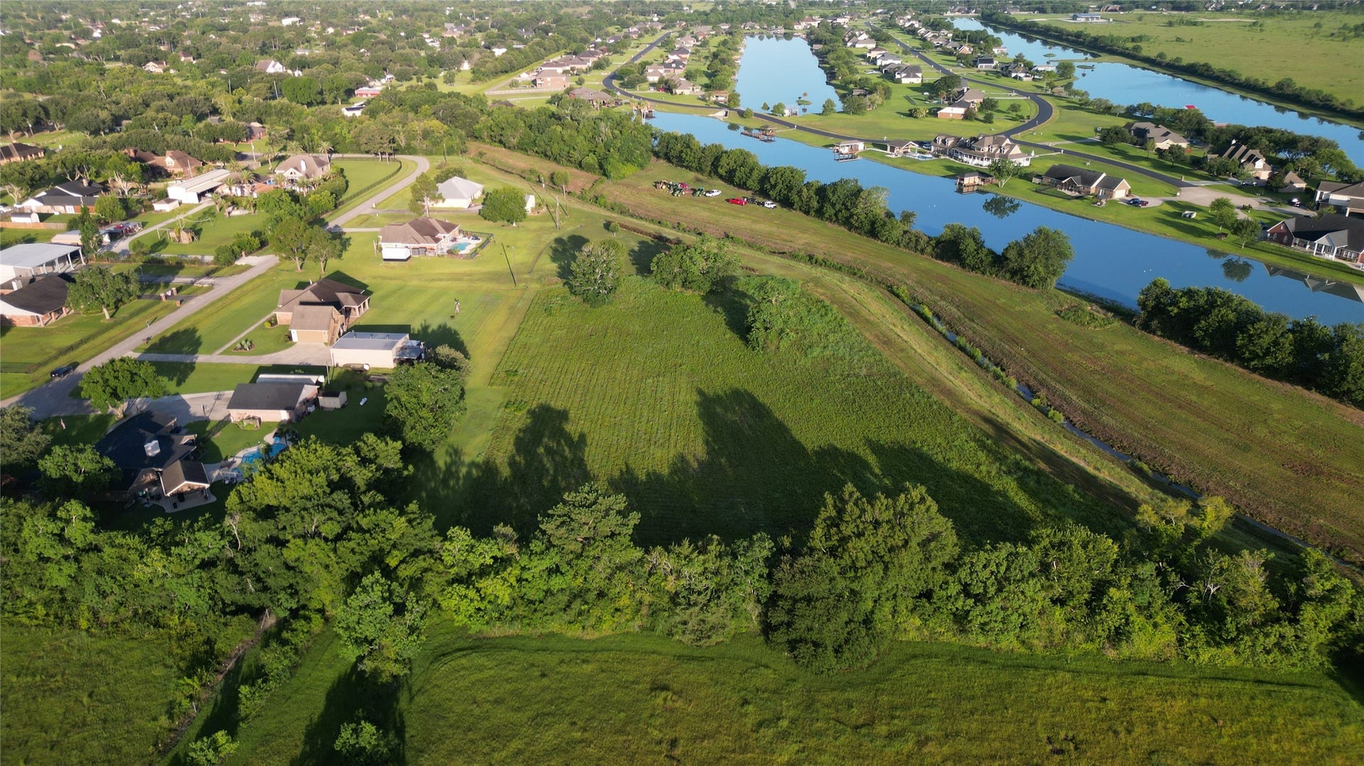 000 Penny Ln, Santa Fe, TX 77510 With a the Lago of Santa Fe lake behind the property and a tree line to one side, this location offers optimal privacy.