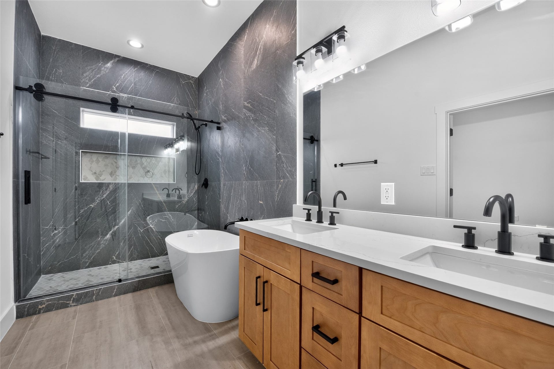 3537 Amos Street, Houston, TX 77021 Bright, beautifully appointed, and designed to unwindfeaturing dual vanities, a relaxing soaking tub, oversized glass-enclosed shower, and transom window that brings in even more natural light. A polished retreat that brings everyday luxury home.