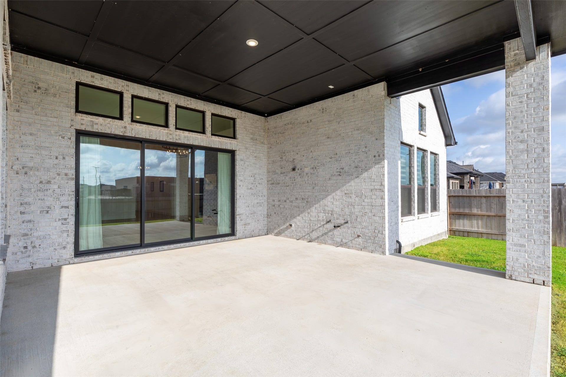 2015 Jade Manor Drive, Rosenberg, TX 77469 Sliding glass doors and a view of the backyard, perfect for outdoor entertaining.